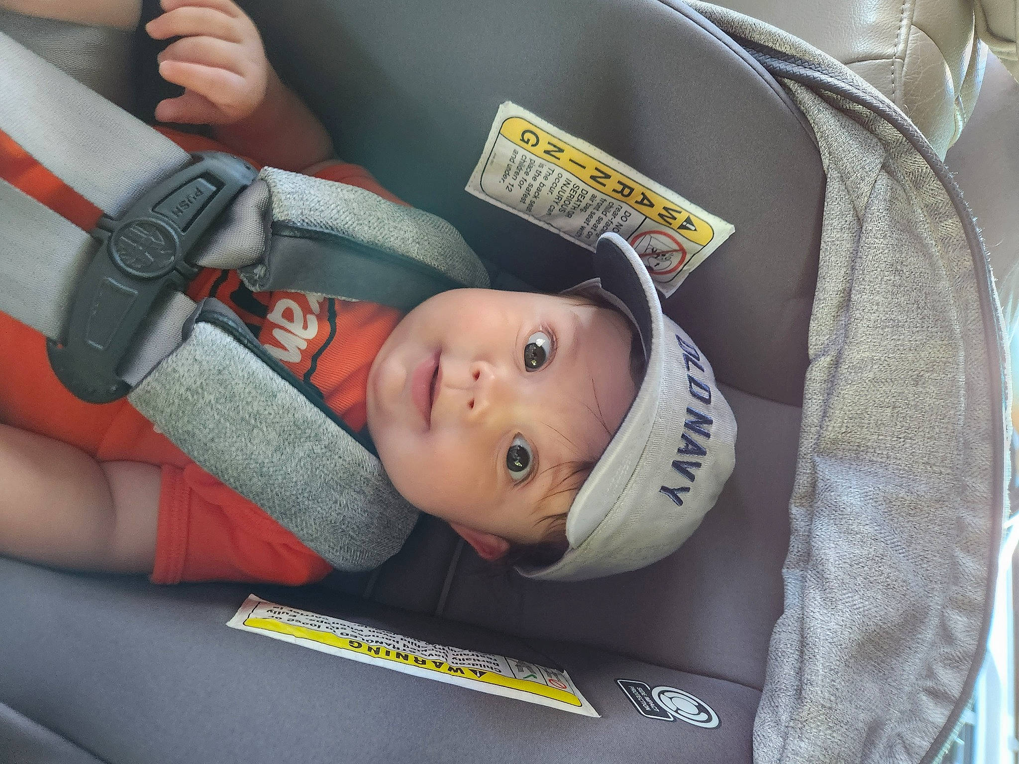 Paisley is registered to the contest to win money with this photo: auto_part, baby, baby_carriage, baby_in_car_seat, baby_products, baby_safety, car_seat, car_seat_cover, carmine, child, comfort, family_car, finger, gesture, headwear, person, seat_belt, service, thumb, toddler