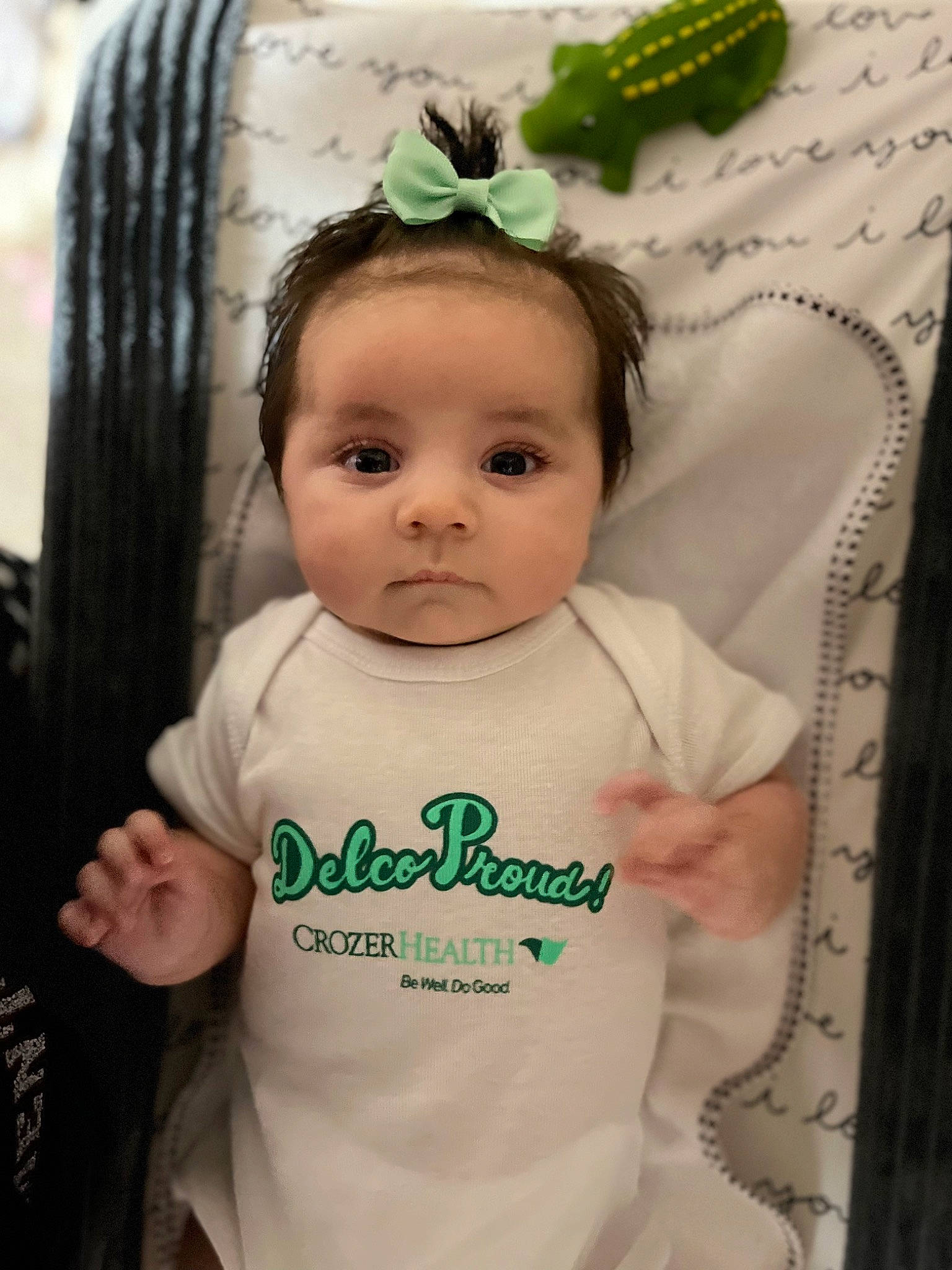 Serena joined the competition — help win amazing prizes! baby, baby_products, baby_toddler_clothing, cap, cheek, child, cool, eyelash, fashion_accessory, green, hair_accessory, hairstyle, happy, headband, headpiece, jewellery, person, skin, sleeve, t_shirt