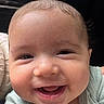 Bryan is registered to the contest to win money with this photo: baby, smiling, face, child, infant, clothing, car, car_door, seat, portrait, happy, cute, skin, head, person, young, expression, indoors, closeup, joy
