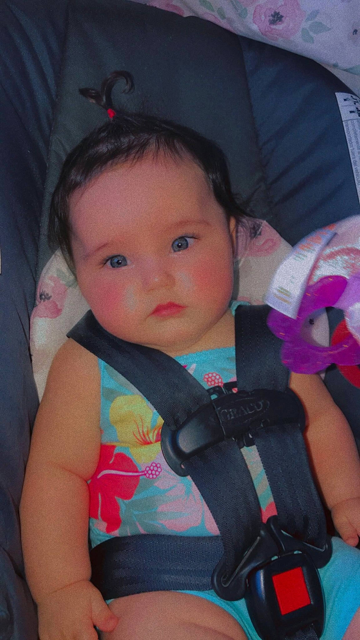 Kora is registered to the contest to win money with this photo: baby, baby_carriage, baby_toddler_clothing, cheek, child, comfort, ear, eye, eyelash, facial_expression, finger, hairstyle, iris, lip, organ, person, pink, product, seat_belt, skin