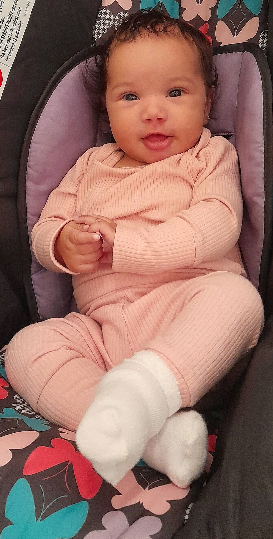 Peighton Dior Fuqua joined the competition — help win amazing prizes! baby, baby_toddler_clothing, cheek, comfort, finger, human_leg, knee, lap, leg, lip, nose, person, pink, seat_belt, skin, sleeve, smile, sock, thigh, toddler