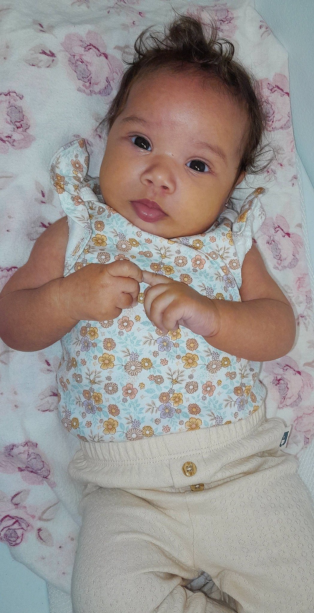 Peighton Dior Fuqua is registered to the contest to win money with this photo: baby, baby_toddler_clothing, cheek, chin, eye, face, finger, gesture, hairstyle, hand, happy, iris, lip, neck, nose, person, pink, skin, sleeve, textile