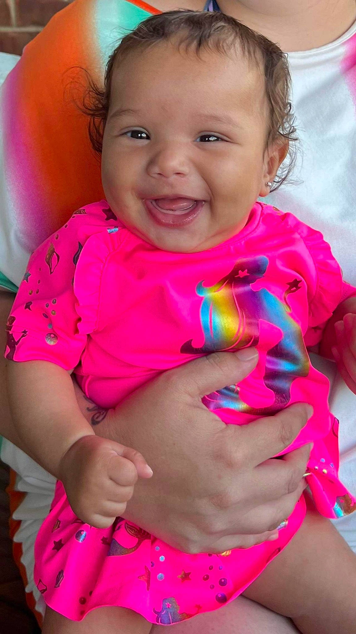 Peighton Dior Fuqua is registered to the contest to win money with this photo: arm, baby_toddler_clothing, cheek, eye, face, facial_expression, hand, happy, human, human_body, joy, lip, mouth, neck, nose, organ, person, photograph, shoulder, skin