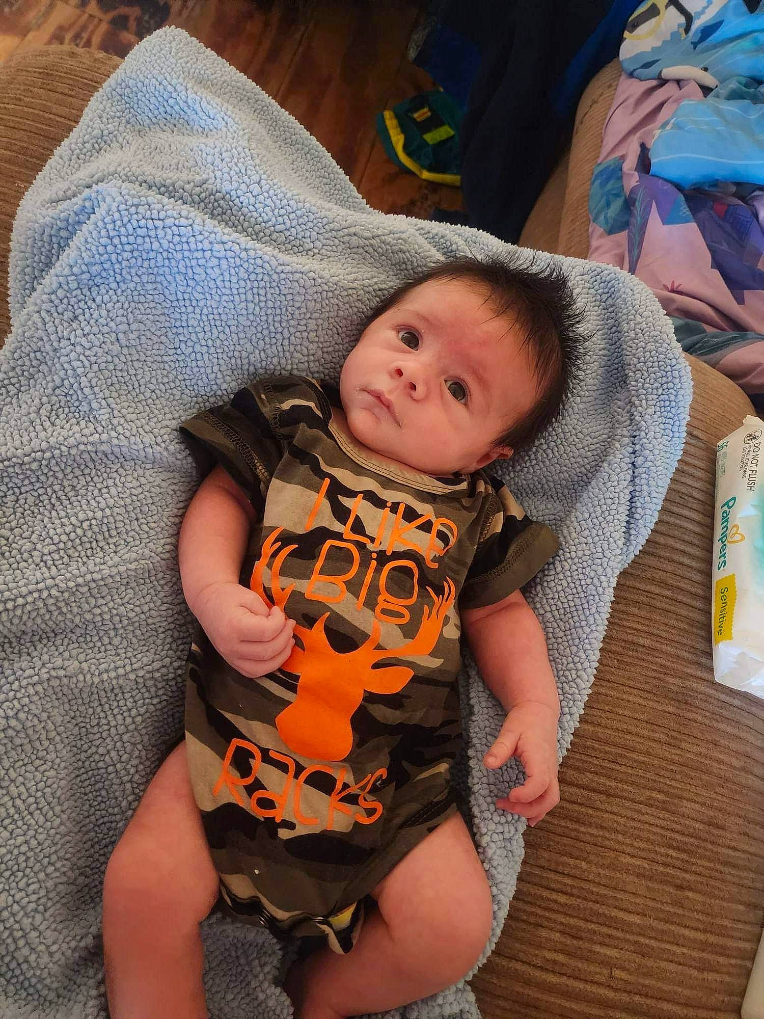 Gabriel joined the competition — help win amazing prizes! abdomen, baby, baby_products, baby_toddler_clothing, cheek, child, comfort, eye, fun, grass, happy, human_leg, lap, mouth, orange, person, sitting, skin, thigh, toddler