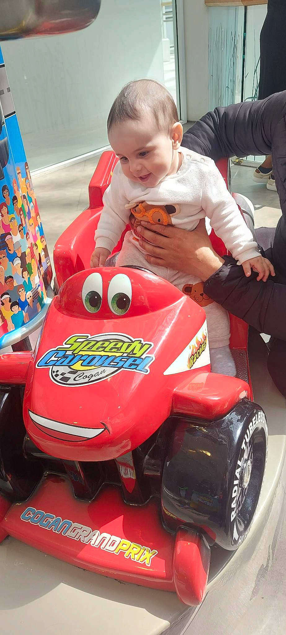 Dominic Darius joined the competition — help win amazing prizes! automotive_design, automotive_exterior, automotive_tire, baby, child, formula_one_tyres, fun, motor_vehicle, motorsport, person, personal_protective_equipment, play, red, riding_toy, rim, sitting, tire, toddler, toy_vehicle, vehicle