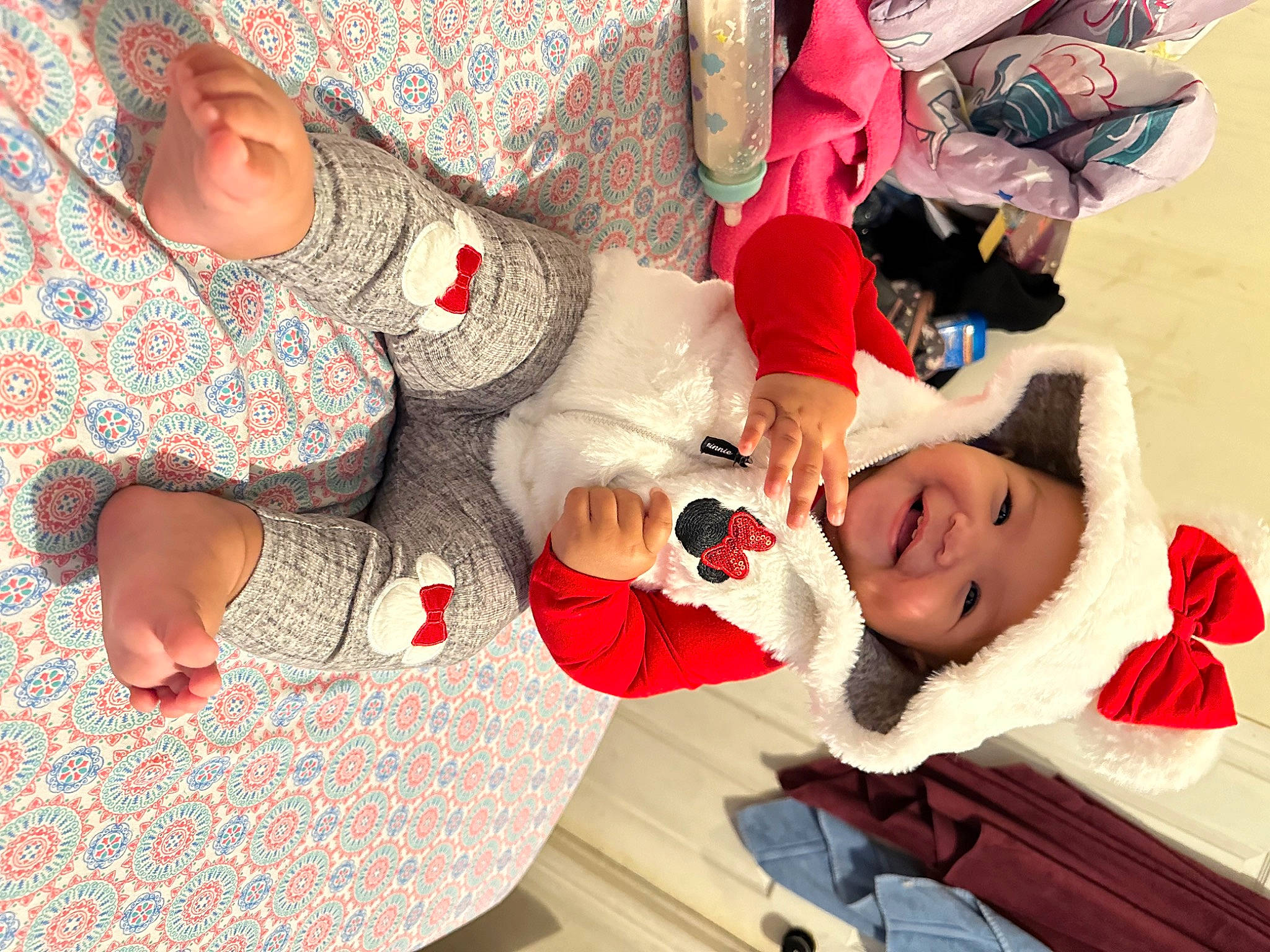 Nevaeh is registered to the contest to win money with this photo: baby, carmine, child, comfort, event, finger, fun, gesture, happy, headwear, human_leg, joy, lap, leisure, nail, pattern, person, smile, sunglasses, thigh