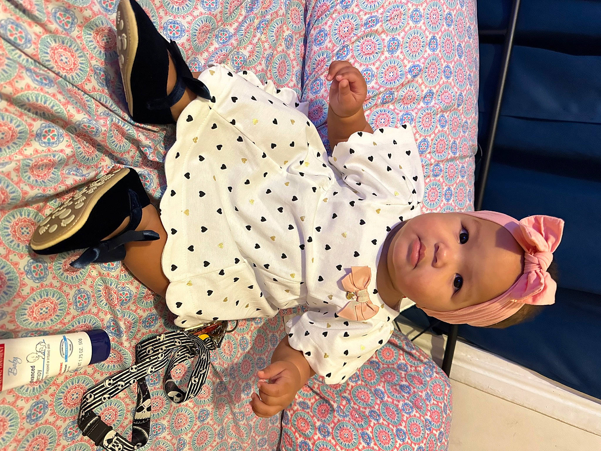 Nevaeh joined the competition — help win amazing prizes! baby_toddler_clothing, child, craft, hat, headwear, linens, paper, paper_product, pattern, person, polka_dot, room, sleeve, smile, textile, toy, vintage_clothing, visual_arts