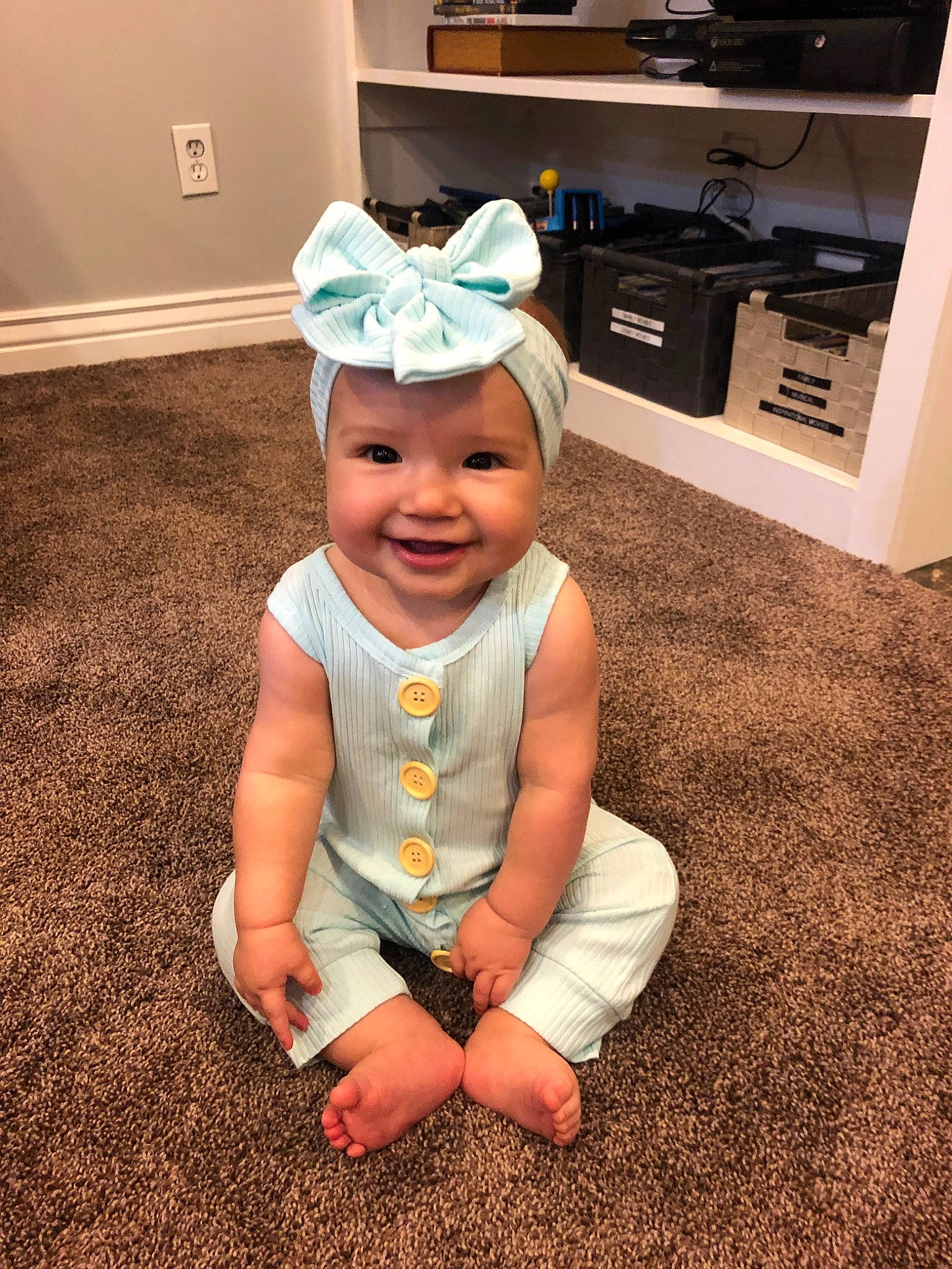 Marley Mae joined the competition — help win amazing prizes! baby, baby_toddler_clothing, cap, child, costume, dress, ear, fashion_accessory, floor, flooring, hat, head, headgear, headwear, joy, person, play, sitting, skin, smile