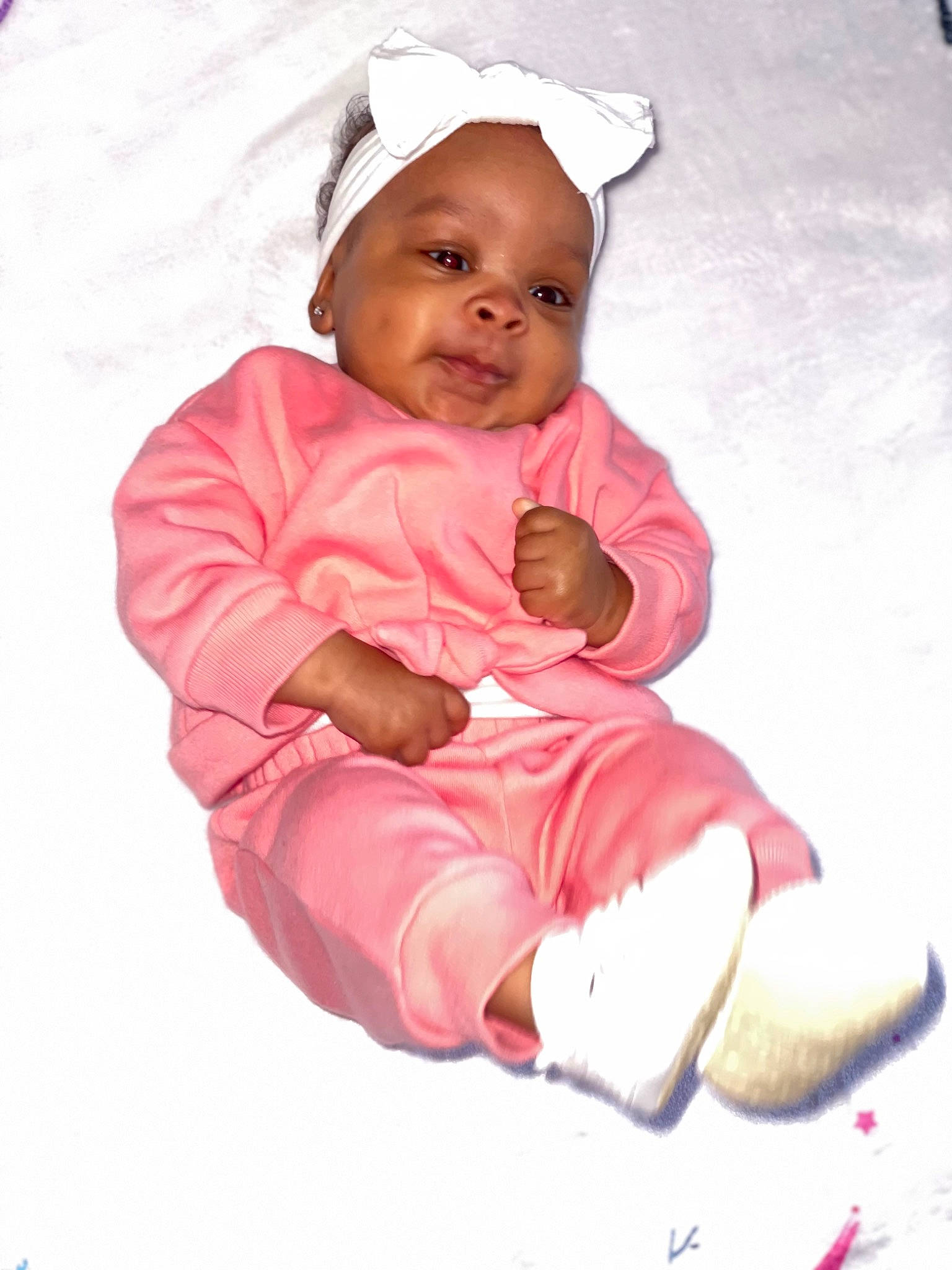 Alayah is registered to the contest to win money with this photo: baby, baby_products, baby_toddler_clothing, cap, carmine, cheek, child, comfort, face, happy, headgear, hood, hoodie, linens, magenta, person, sitting, sleeve, smile, toddler