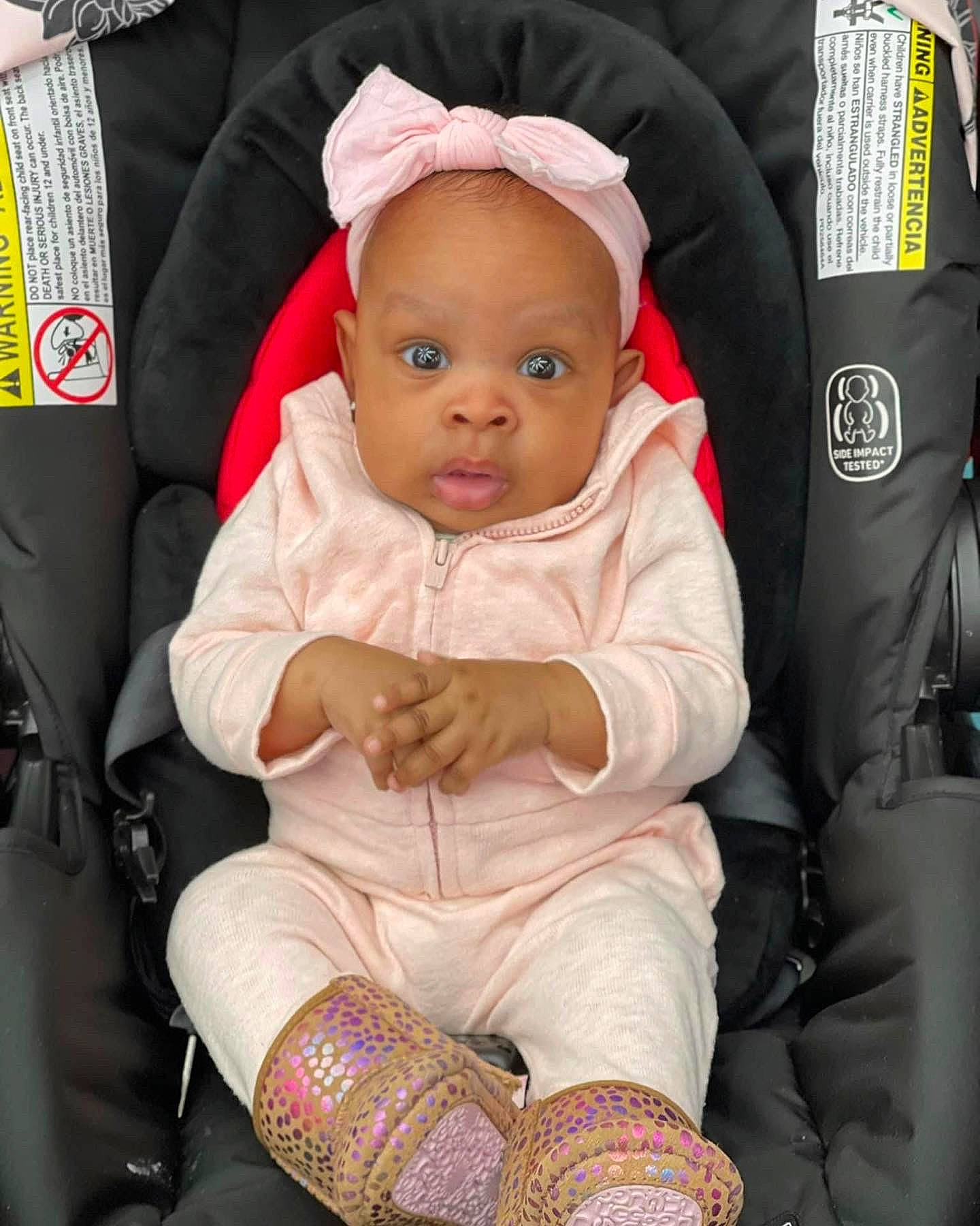 Alayah is registered to the contest to win money with this photo: baby, baby_carriage, baby_products, baby_safety, baby_toddler_clothing, car_seat, chair, child, comfort, fashion_accessory, foot, knee, lap, person, product, sitting, skin, sleeve, sock, toddler