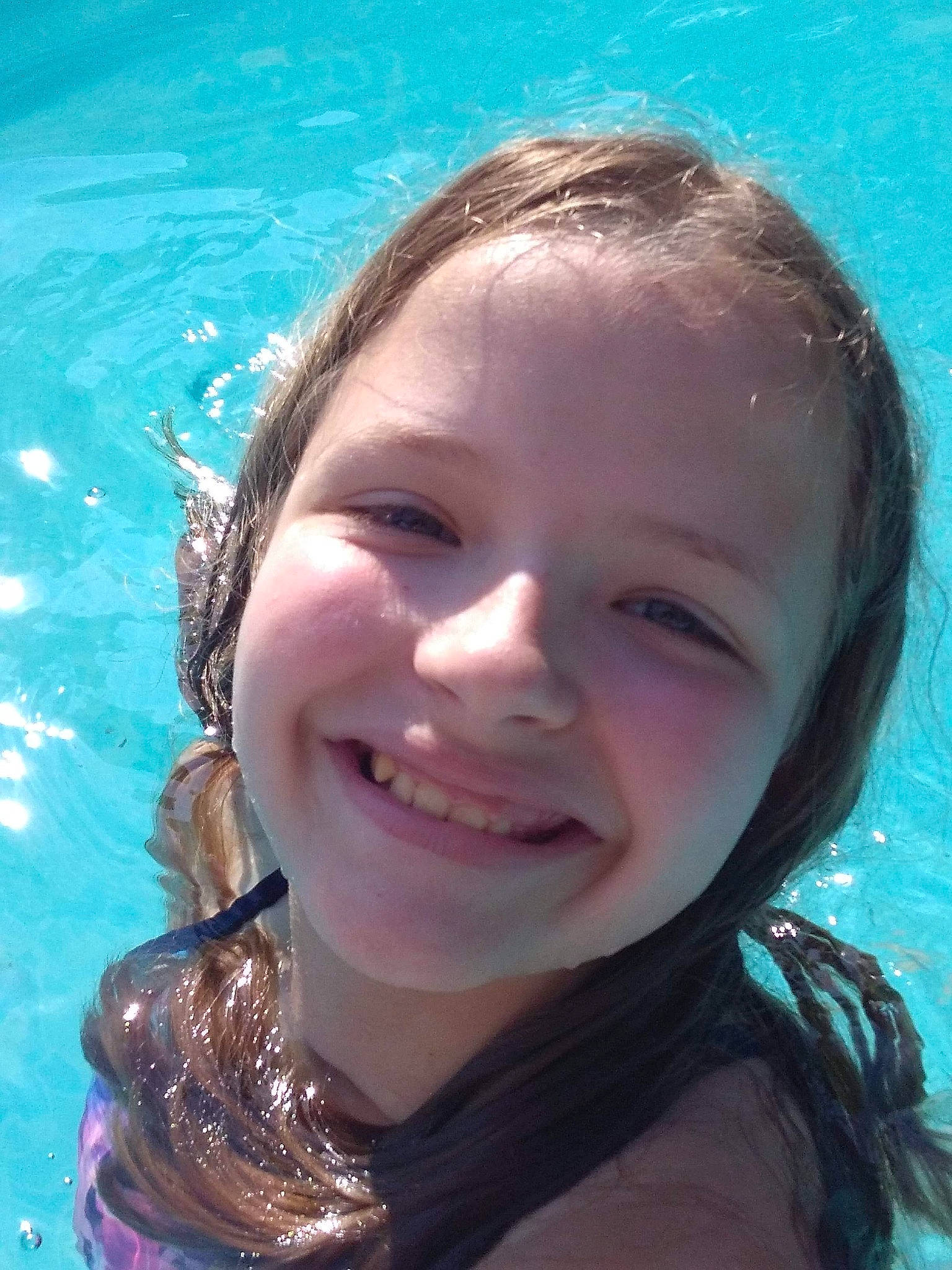 Lexi is registered to the contest to win money with this photo: beauty, child, chin, eyebrow, face, facial_expression, forehead, fun, happy, head, joy, lip, mouth, nose, person, recreation, skin, smile, summer, swimming_pool