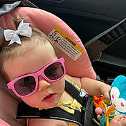 Madison joined the competition — help win amazing prizes! baby, child, car_seat, sunglasses, pink, white_bow, toy, blue_monkey, seatbelt, car_interior, cute, infant, child_safety, summer, accessory, baby_toy, portrait, closeup, person, seat