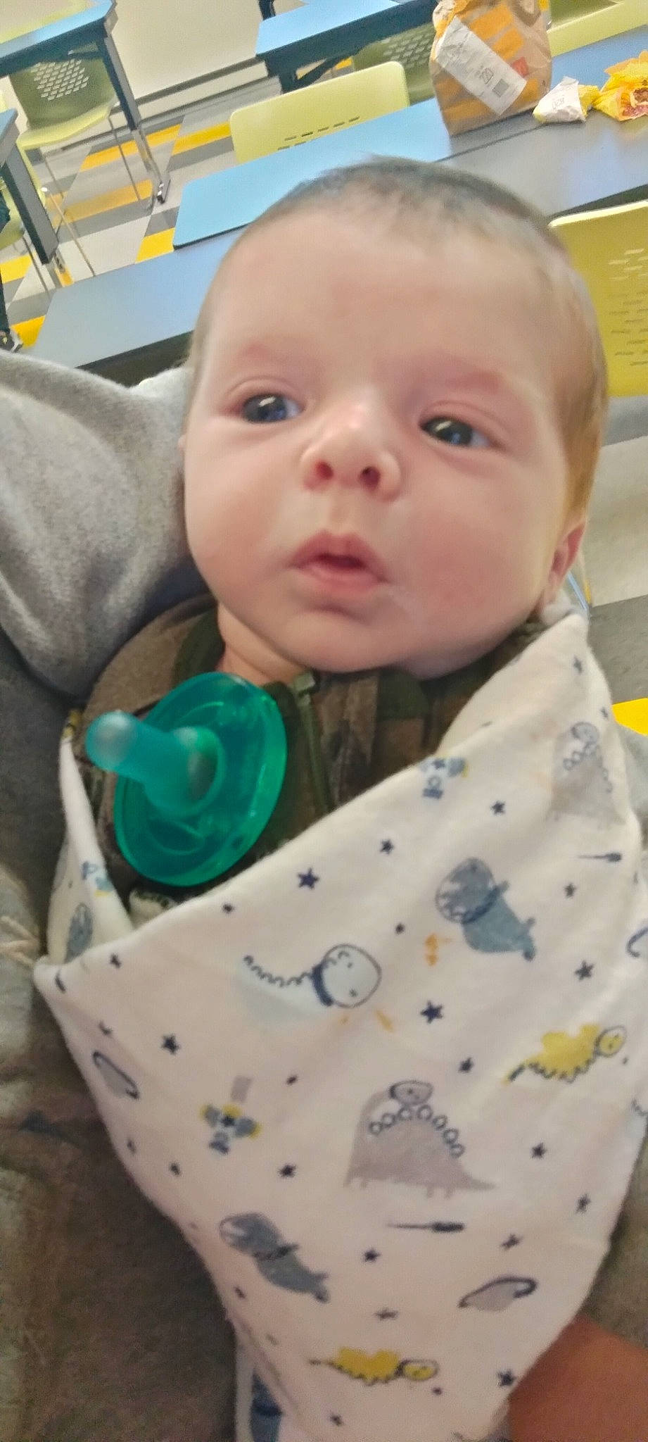 Liam James is registered to the contest to win money with this photo: baby, baby_products, baby_safety, baby_toddler_clothing, cheek, child, collar, comfort, eyelash, happy, iris, linens, nose, outerwear, pattern, person, skin, sleeve, textile, toddler