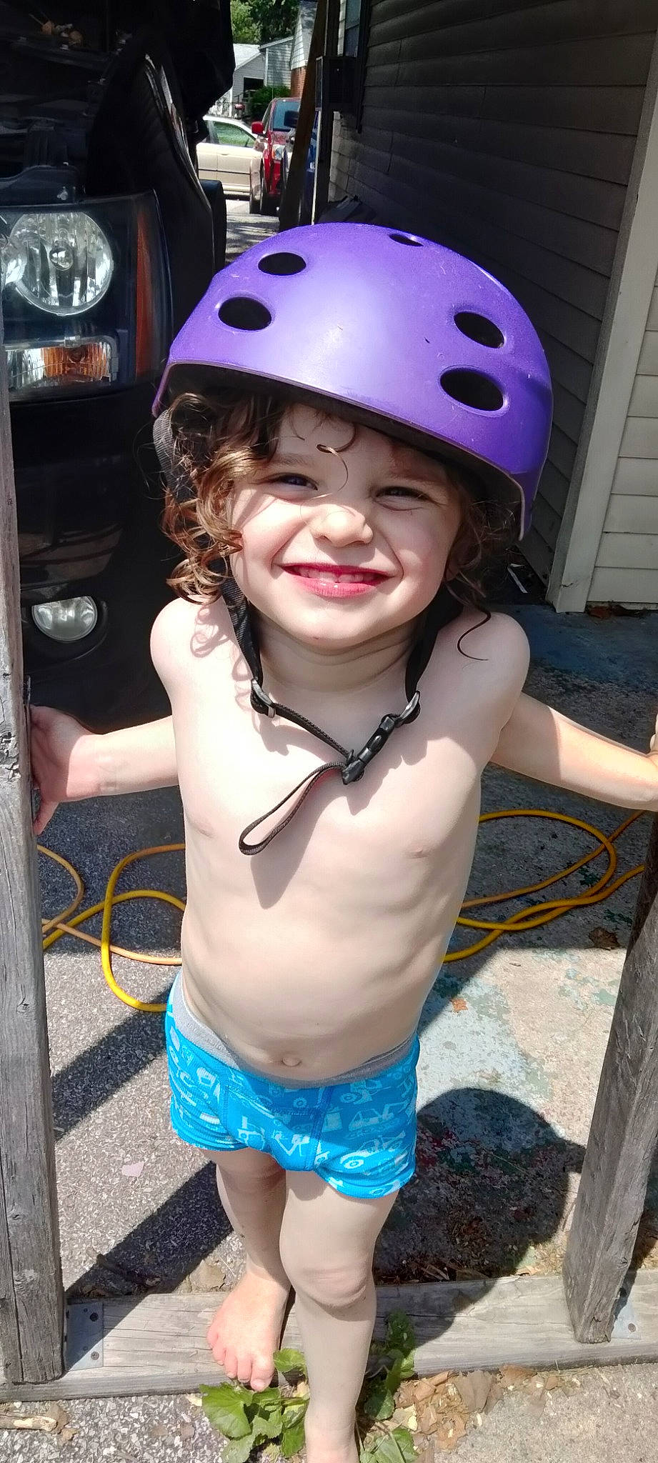 Lucas is registered to the contest to win money with this photo: bicycle_helmet, bicycles_equipment_and_supplies, cap, child, fashion_accessory, fun, happy, headwear, helmet, joy, person, personal_protective_equipment, pink, recreation, smile, snapshot, sports_equipment, sports_gear, swimwear, tire