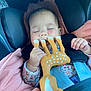 Jade a rejoint le concours — aidez-le/la à gagner de superbes lots ! baby, car_seat, child, closeup, clothing, cute, floral_pattern, giraffe_toy, hand, indoor, infant, peaceful, pink, portrait, resting, seatbelt, sleeping, soft_lighting, toy, young_child