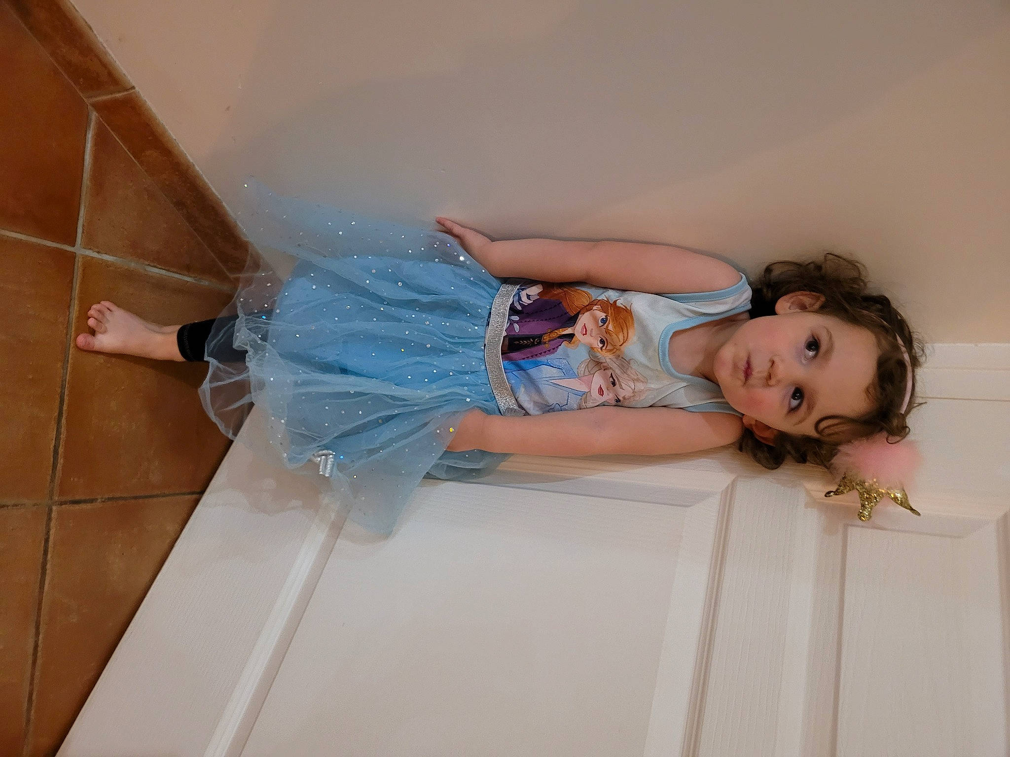 Celeste participe au concours pour gagner de l'argent avec cette photo : baby_toddler_clothing, child, comfort, dress, elbow, floor, flooring, human_leg, joint, knee, leg, person, room, shoulder, stairs, textile, thigh, toddler, waist, wood