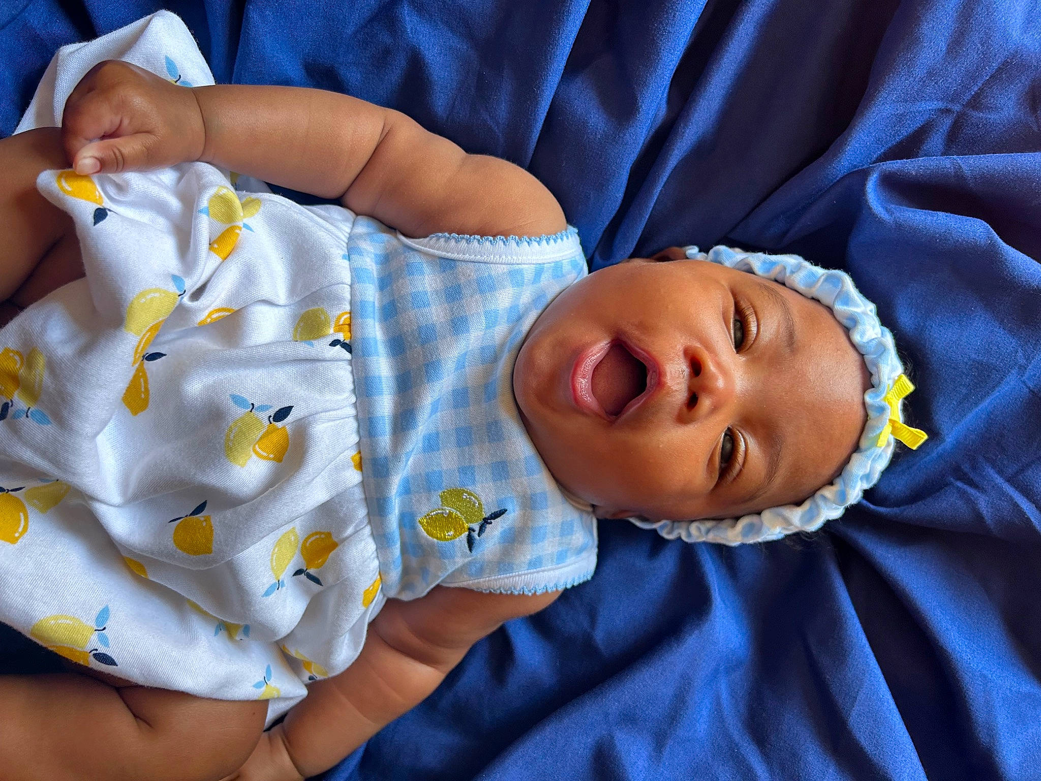 Jorri is registered to the contest to win money with this photo: baby, baby_products, baby_sleeping, baby_toddler_clothing, blue, child, comfort, elbow, electric_blue, eye, linens, mouth, pattern, person, room, skin, sleep, sleeve, smile, textile