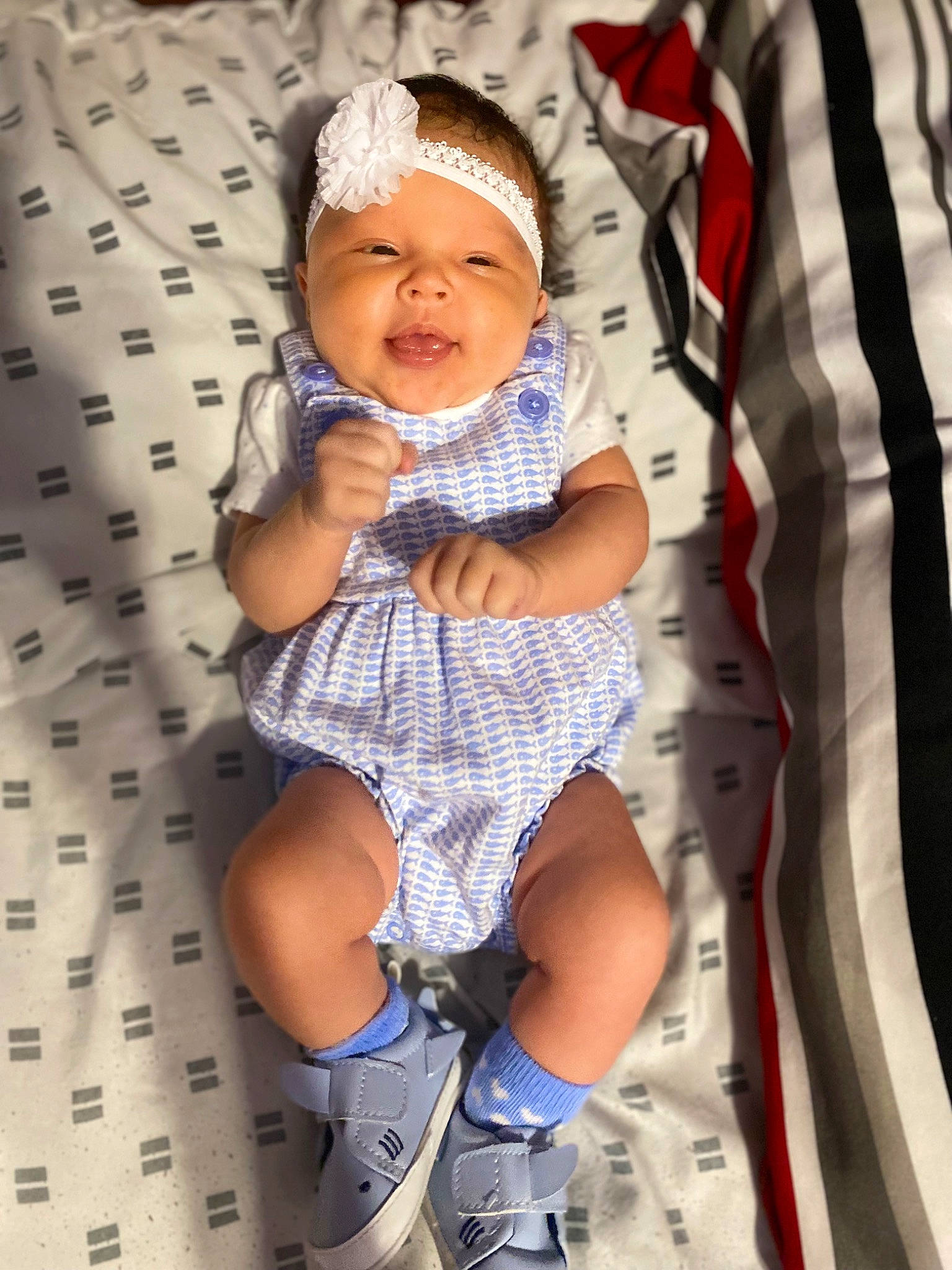 Elianna is registered to the contest to win money with this photo: baby, baby_toddler_clothing, cap, child, comfort, fun, happy, headwear, human_leg, linens, pattern, person, product, shorts, sleeve, smile, sock, t_shirt, textile, thigh