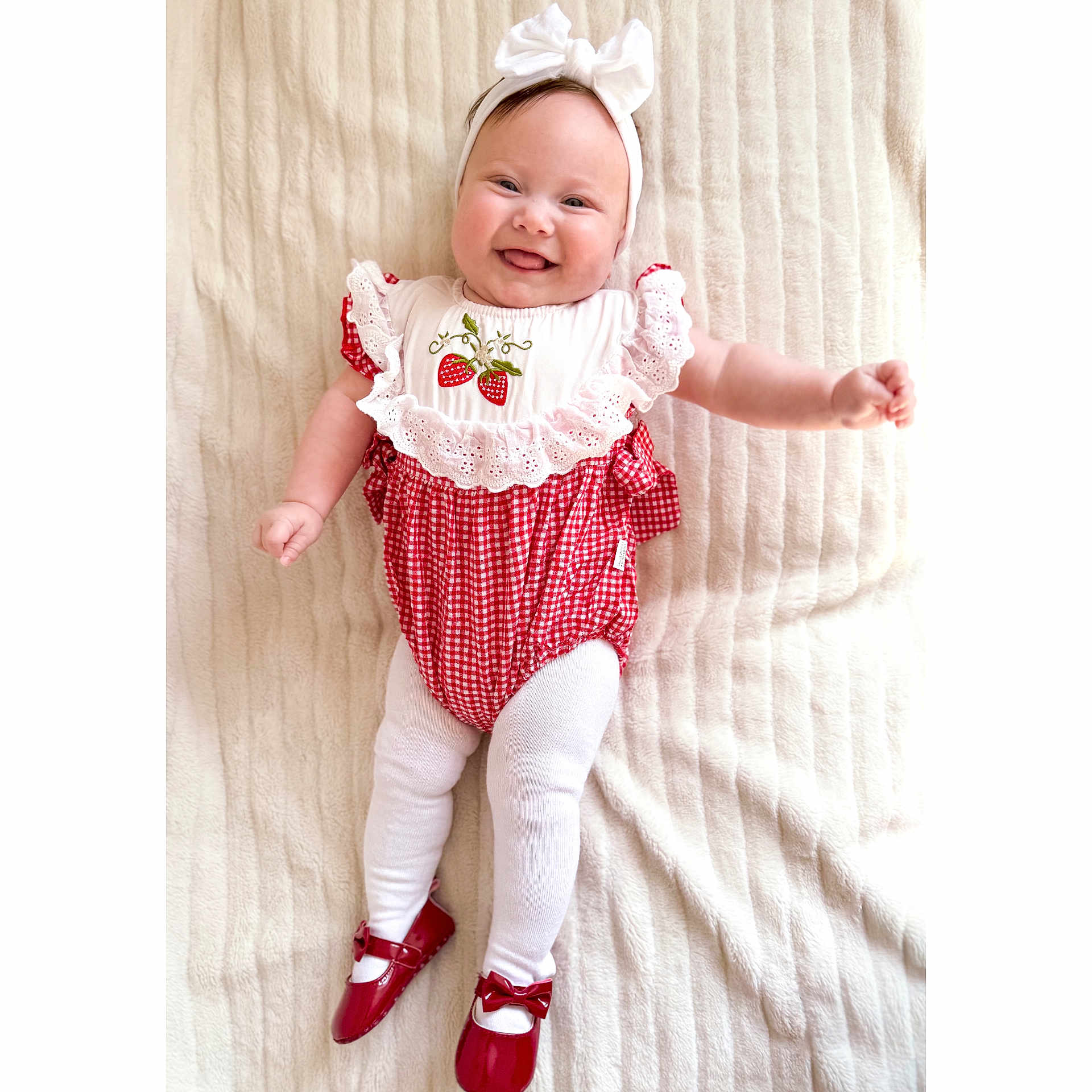 Billy-Ellen joined the competition — help win amazing prizes! adorable, baby, blanket, child, cute, fashion, happy, headband, indoors, infant, lying_down, portrait, red_and_white_outfit, red_shoes, small_feet, small_hands, smiling, soft_texture, strawberry_embroidery, white_tights