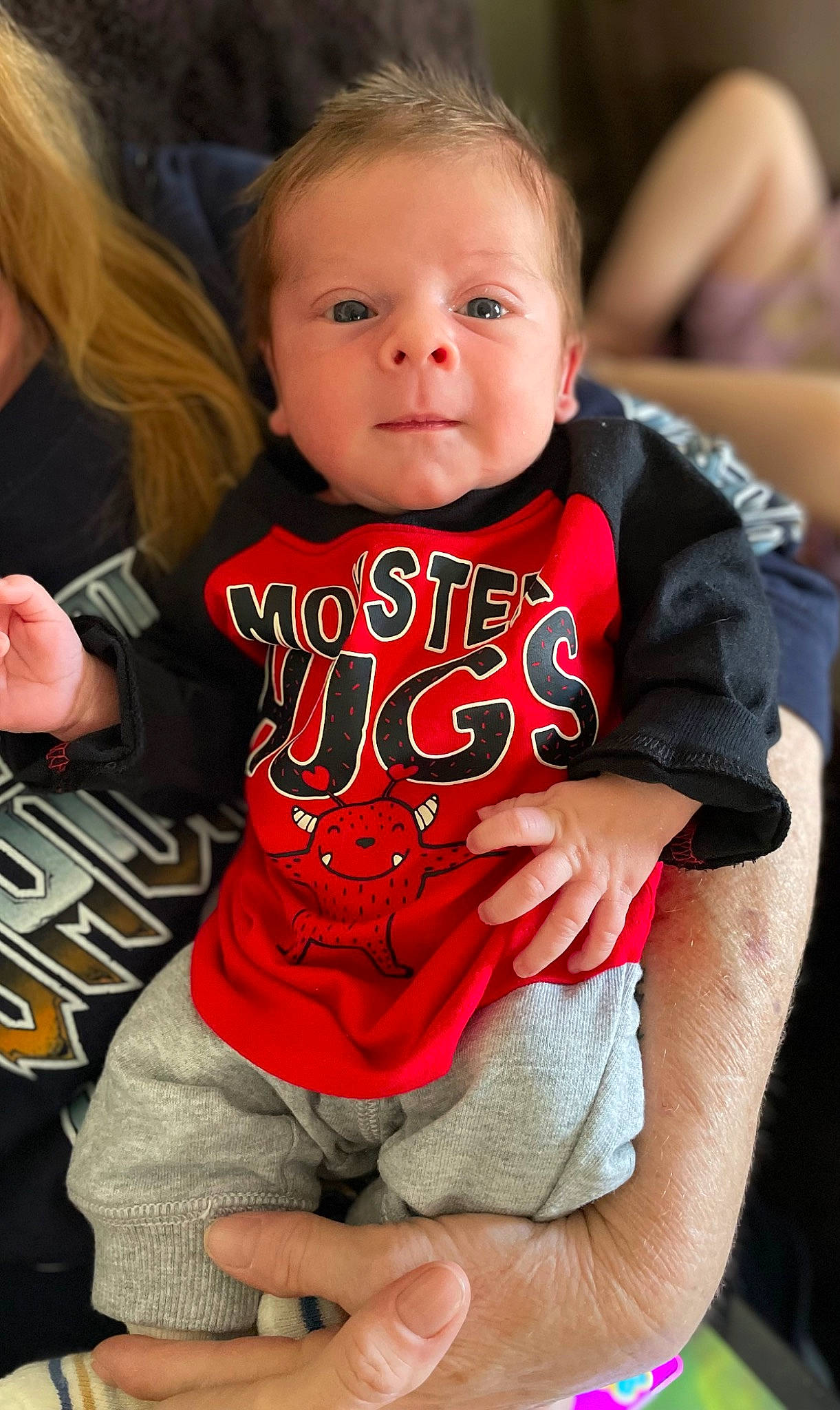 Axton is registered to the contest to win money with this photo: baby_toddler_clothing, chair, cheek, face, facial_expression, finger, hairstyle, happy, head, joint, muscle, neck, person, pink, shoulder, skin, sleeve, smile, thigh, toddler