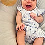 baby, infant, laughing, headband, blue_outfit, two_months, hand, sign, milestone, bed, soft, cute, smile, portrait, skin, happy, child, person, clothing, lying_down