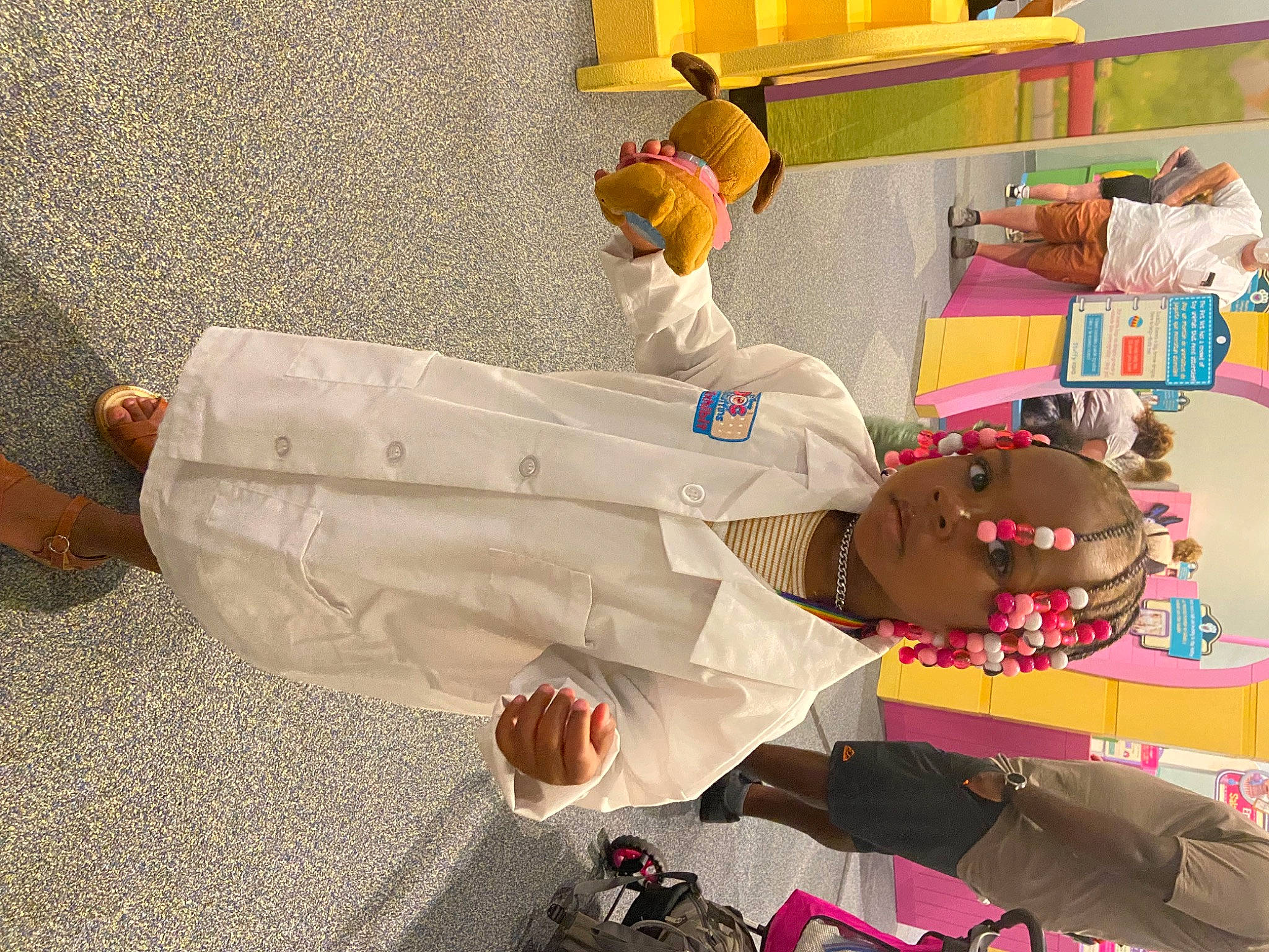 Azminah joined the competition — help win amazing prizes! art, carmine, child, event, flooring, fun, person, plush, room, shelf, shelving, stuffed_toy, toy, visual_arts, yellow