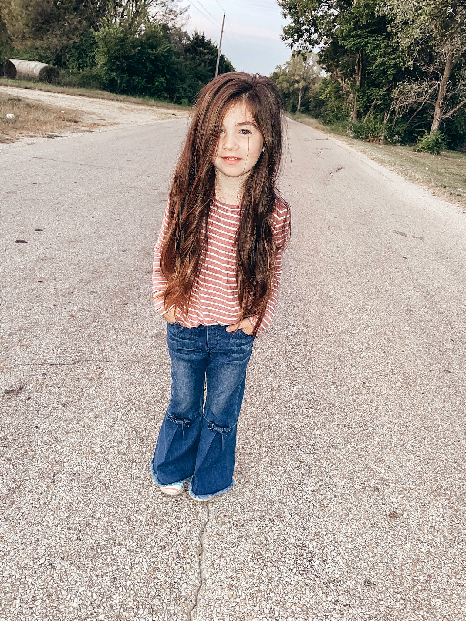 Berkley is registered to the contest to win money with this photo: asphalt, blond, brown_hair, denim, electric_blue, fur, grass, hair, jeans, joy, long_hair, pattern, people_in_nature, person, plaid, plant, road_surface, sleeve, t_shirt, tints_and_shades