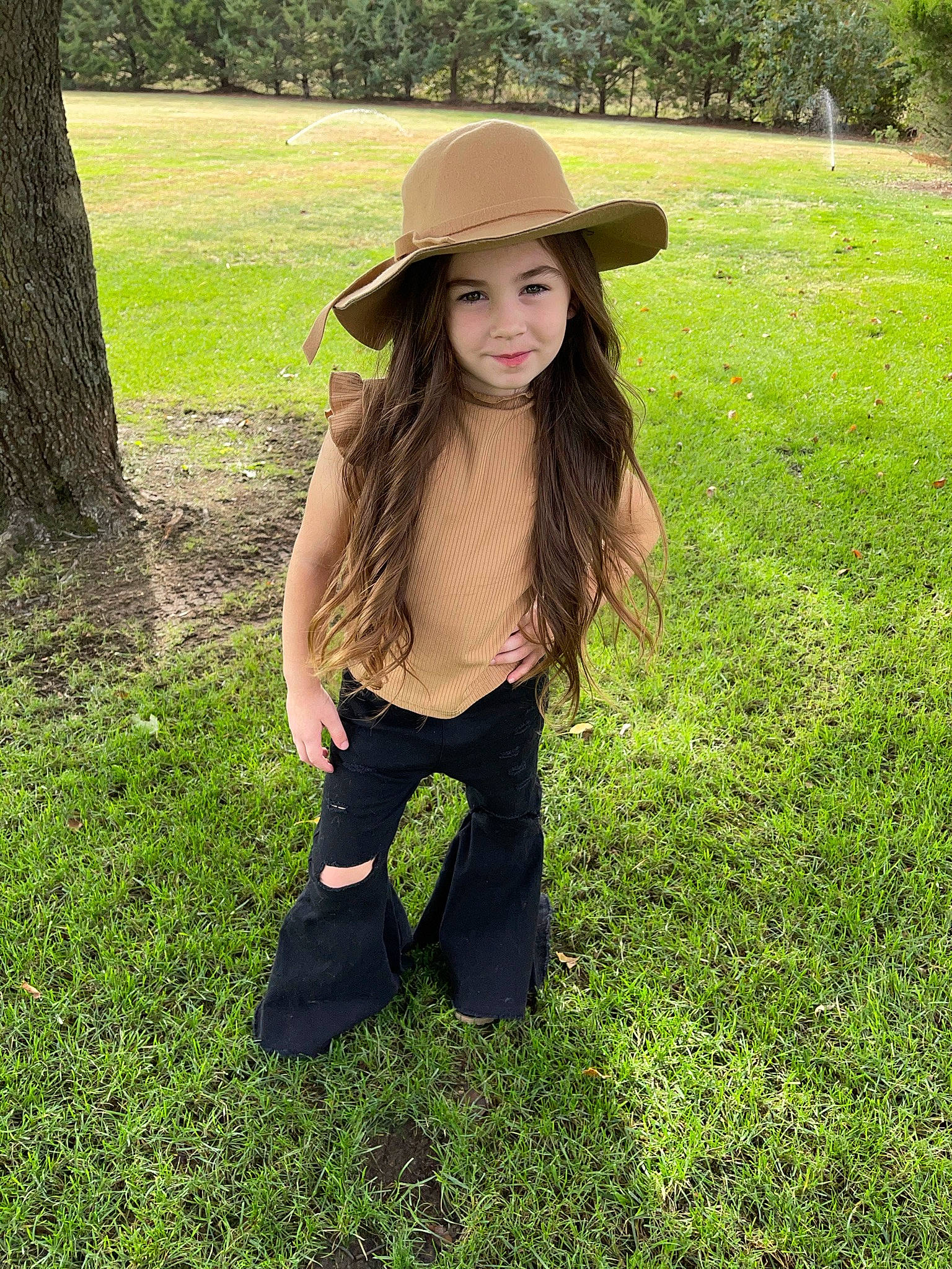 Berkley is registered to the contest to win money with this photo: black_hair, cap, costume_hat, fawn, flash_photography, grass, grassland, hairstyle, happy, hat, headgear, headwear, joy, leaf, meadow, outerwear, people_in_nature, person, plant, smile