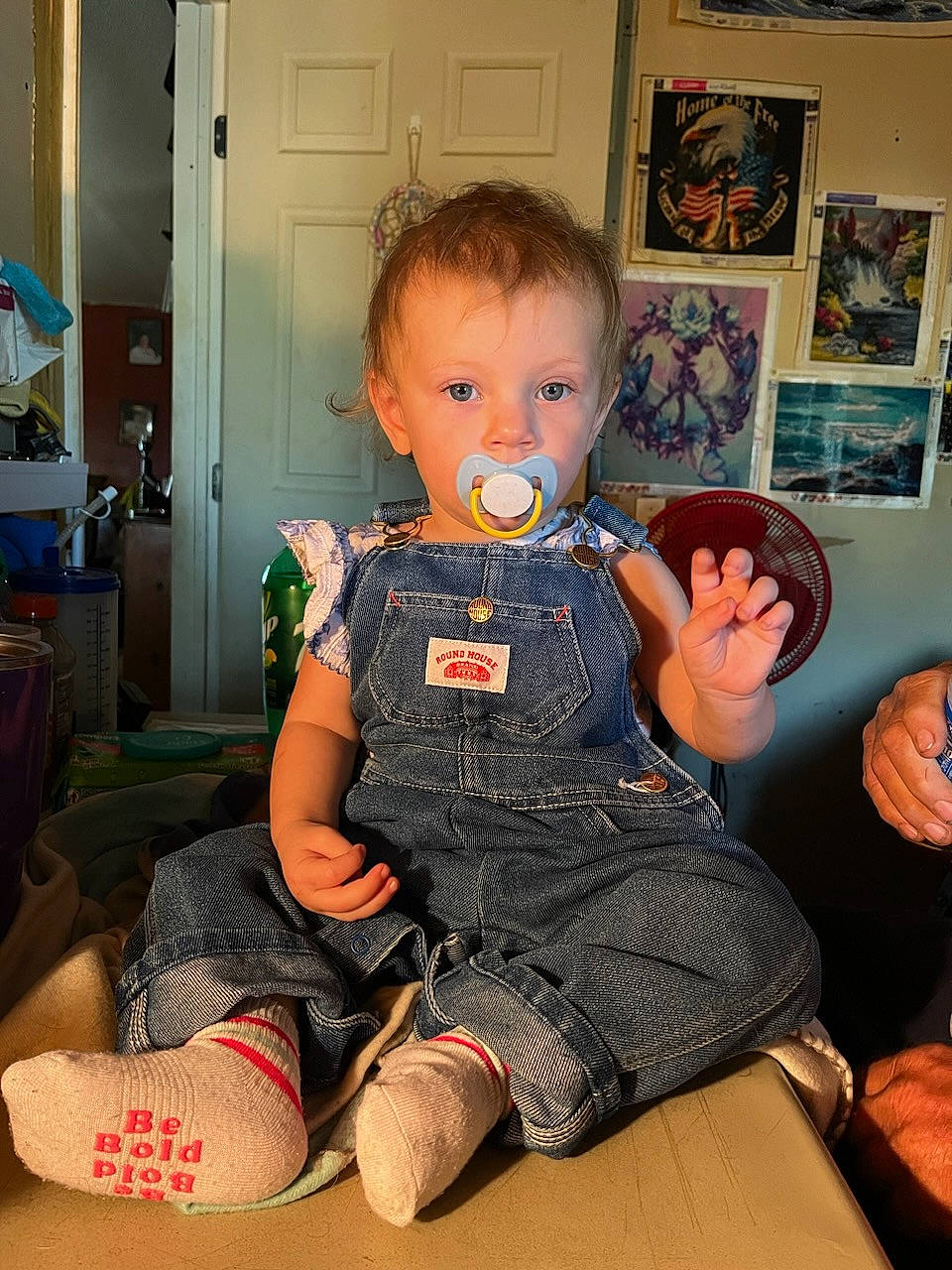 Dakota is registered to the contest to win money with this photo: baby, baby_toddler_clothing, cheek, child, comfort, flooring, fun, gesture, hairstyle, hand, lap, person, picture_frame, play, room, sitting, skin, sleeve, sock, thumb
