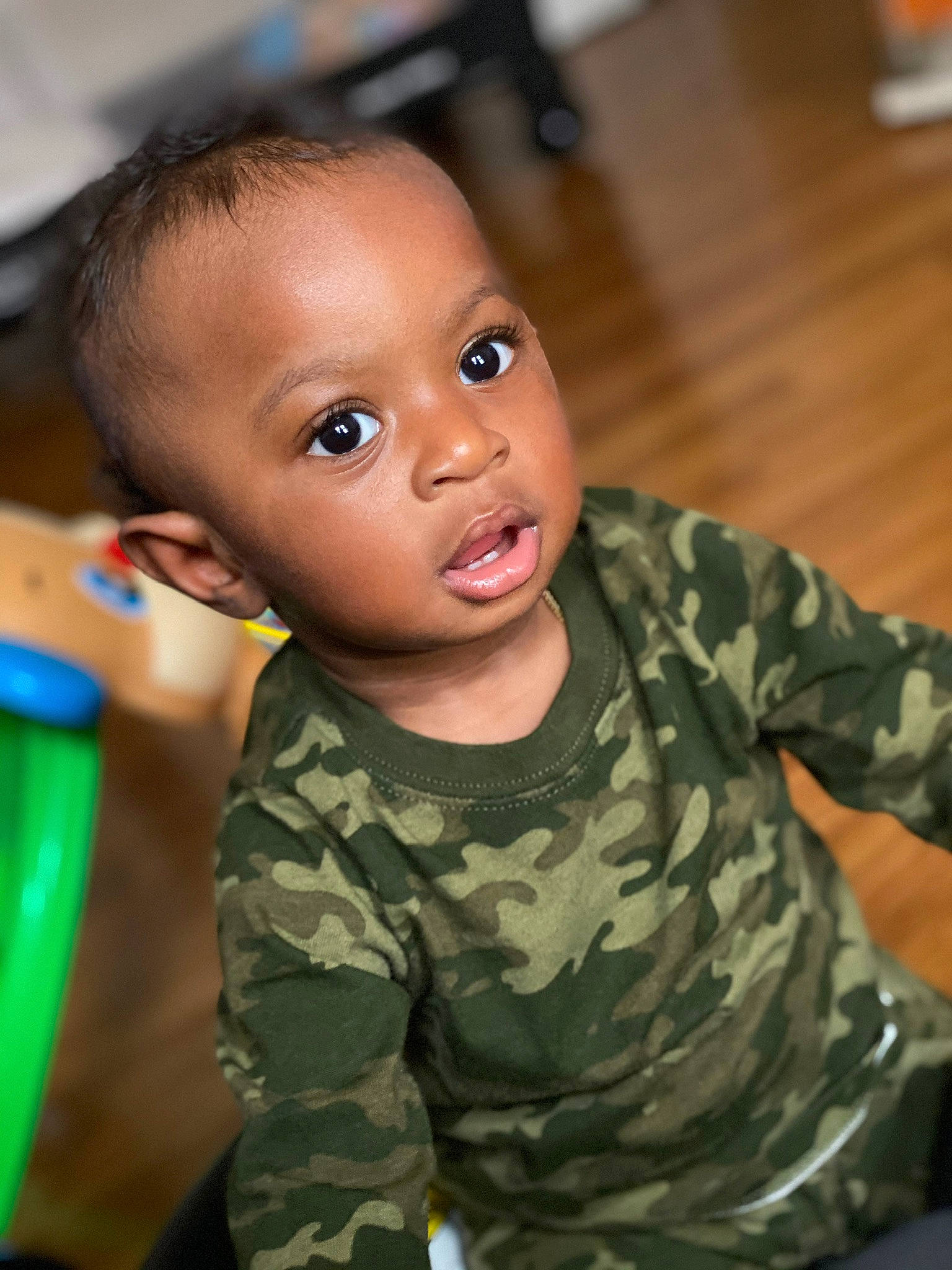 Yasin is registered to the contest to win money with this photo: army, baby, cheek, child, face, head, military, military_camouflage, person, skin, smile, soldier, toddler