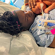 Michael is registered to the contest to win money with this photo: baby, bed, birth, blanket, caregiving, family, hospital, hospital_bed, indoors, infant, medical_equipment, medical_tubing, mother, newborn, parent, peaceful, portrait, recovery, skin_to_skin, sleeping