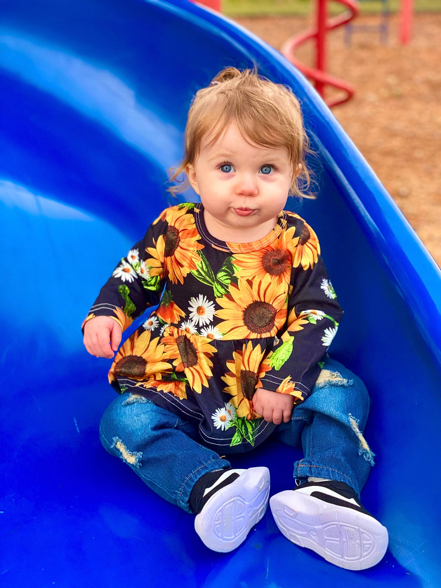 Avalee is registered to the contest to win money with this photo: baby, baby_toddler_clothing, blue, child, chute, city, electric_blue, fun, grass, hairstyle, happy, head, leisure, person, playground, playground_slide, recreation, sitting, smile, sneakers