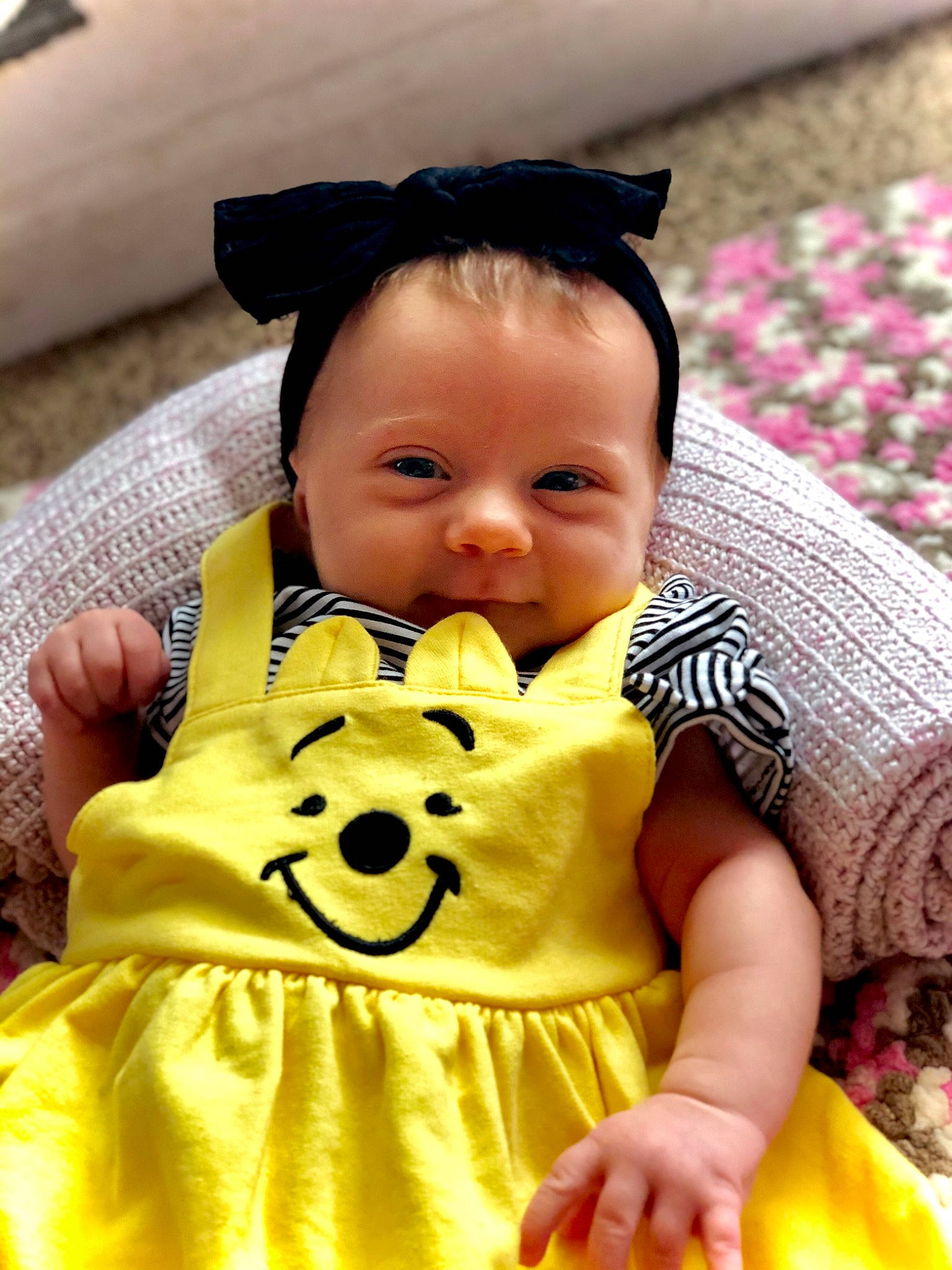 Avalee is registered to the contest to win money with this photo: baby, baby_toddler_clothing, cheek, child, eyelash, face, facial_expression, happy, head, iris, nose, person, photograph, pink, skin, sleeve, smile, textile, toddler, white