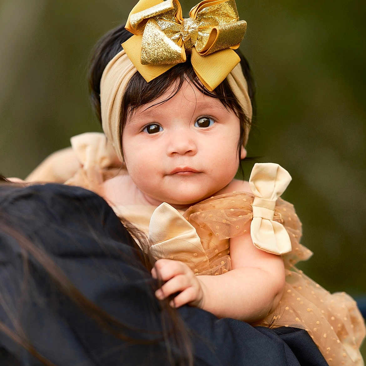 Adalyn is registered to the contest to win money with this photo: accessories, baby, bodypart, bonnet, cap, clothing, dress, face, finger, flower, flowerarrangement, flowerbouquet, formalwear, hand, hat, head, headband, person, photography, portrait