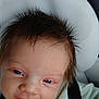 baby, infant, smile, face, hair, car_seat, seatbelt, clothing, cushion, headrest, person, child, sitting, indoors, closeup, happy, skin, eyes, young, cute