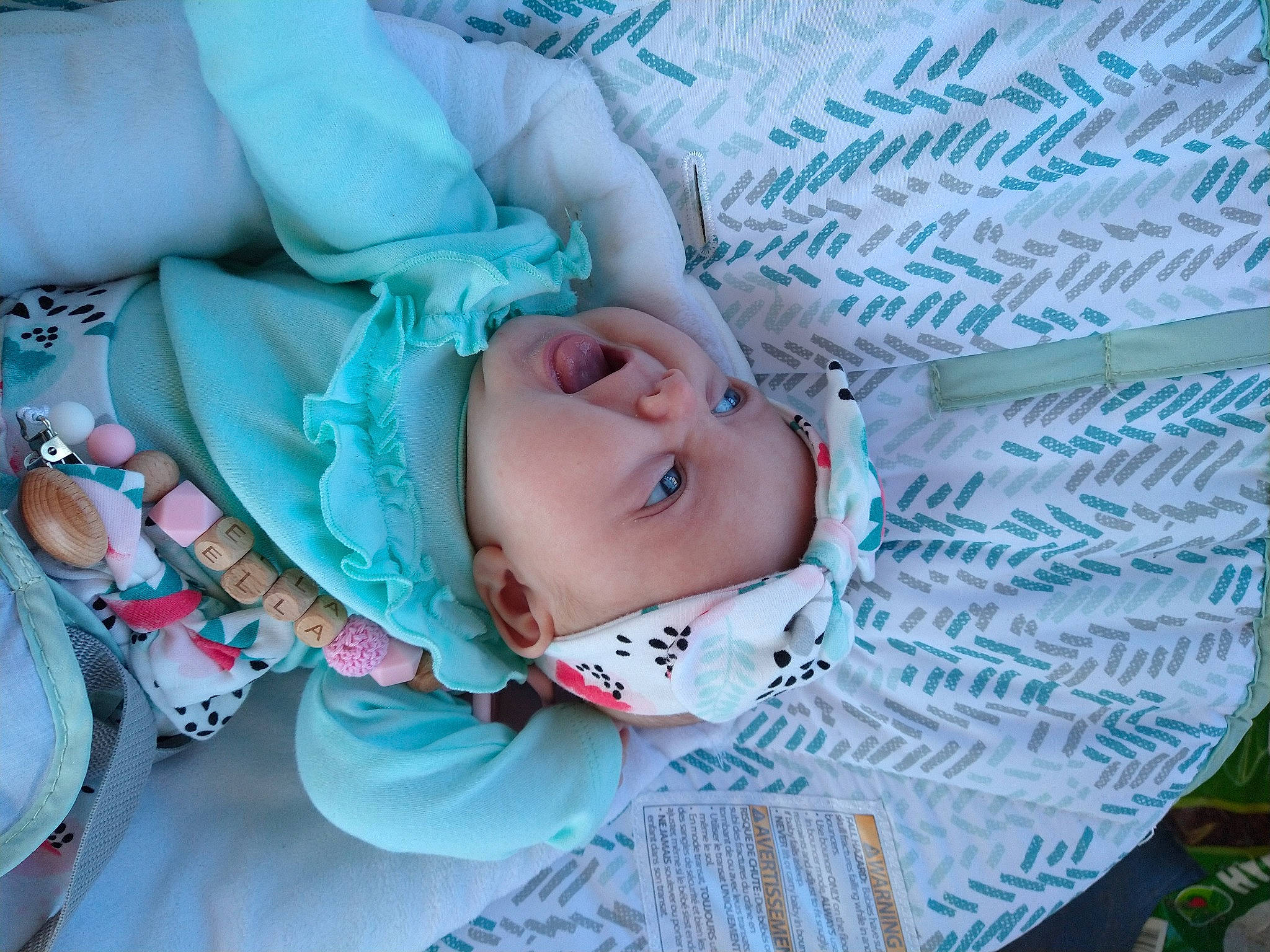 Ella is registered to the contest to win money with this photo: baby, baby_products, baby_toddler_clothing, cheek, child, comfort, electric_blue, grass, happy, headgear, headwear, leaf, linens, nap, pattern, person, skin, sleep, textile, toddler