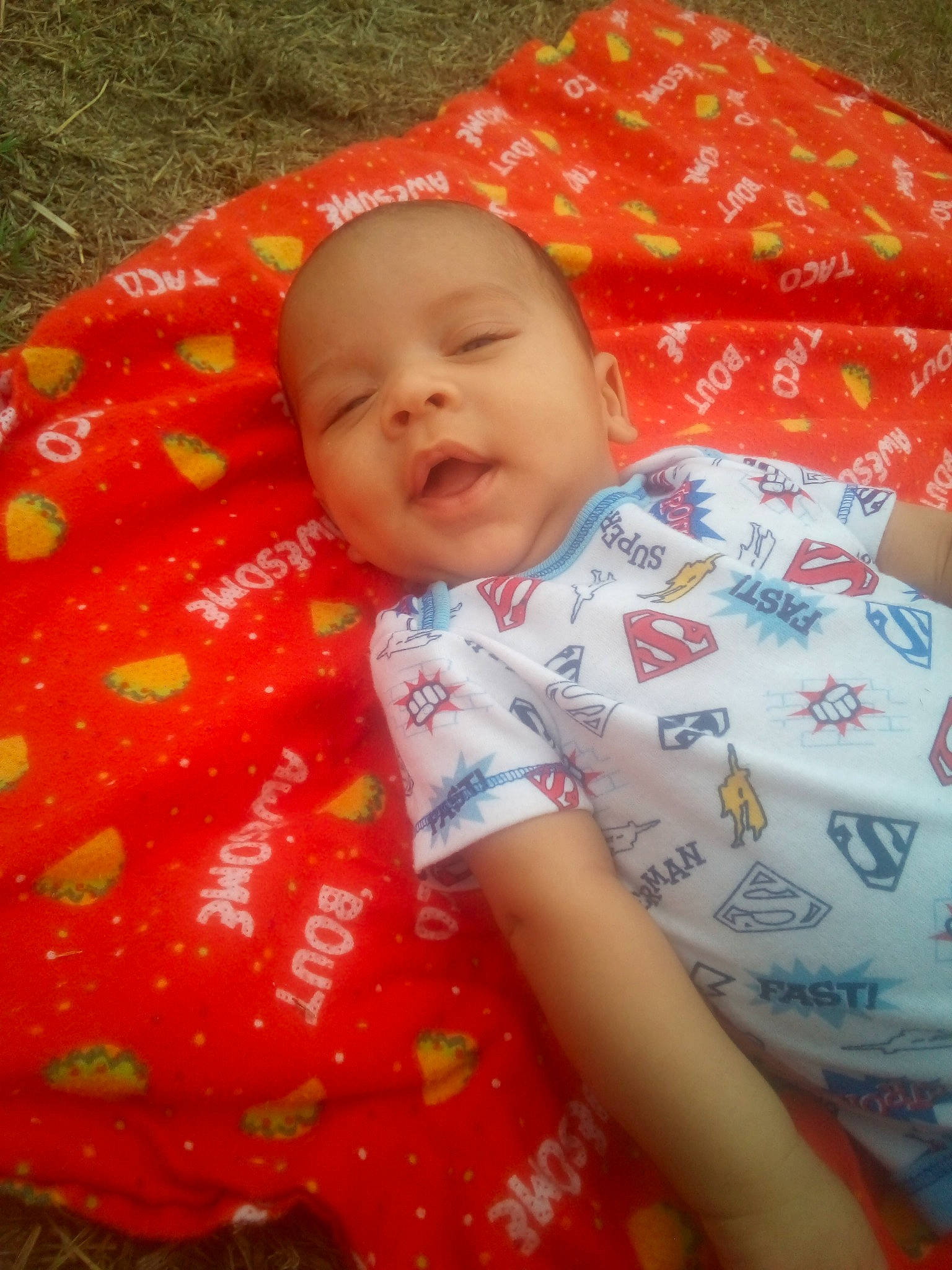 Jenson is registered to the contest to win money with this photo: baby, cheek, child, nap_mat, orange, person, play, red, skin, textile, toddler