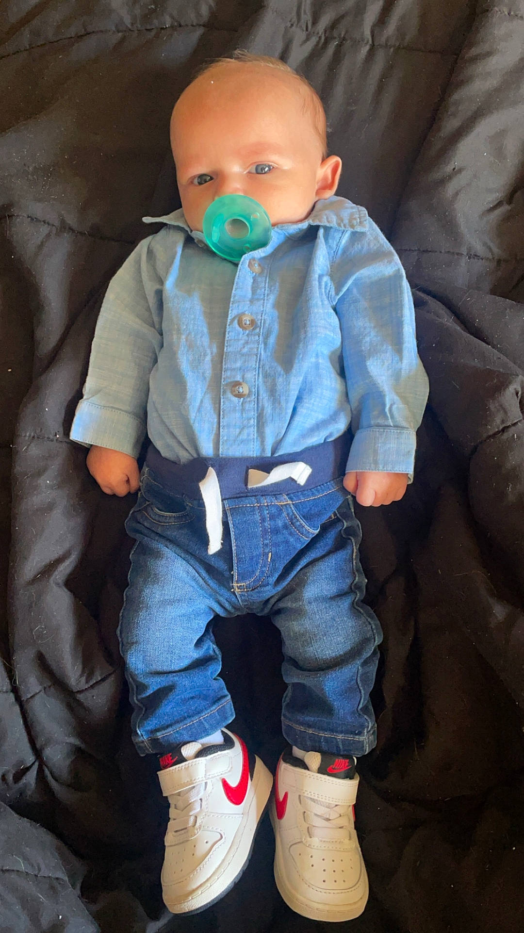 Jeremiah joined the competition — help win amazing prizes! boy, child, clothing, coat, couch, face, footwear, furniture, head, hosiery, jeans, male, pants, person, photography, portrait, shirt, shoe, sneaker, sock