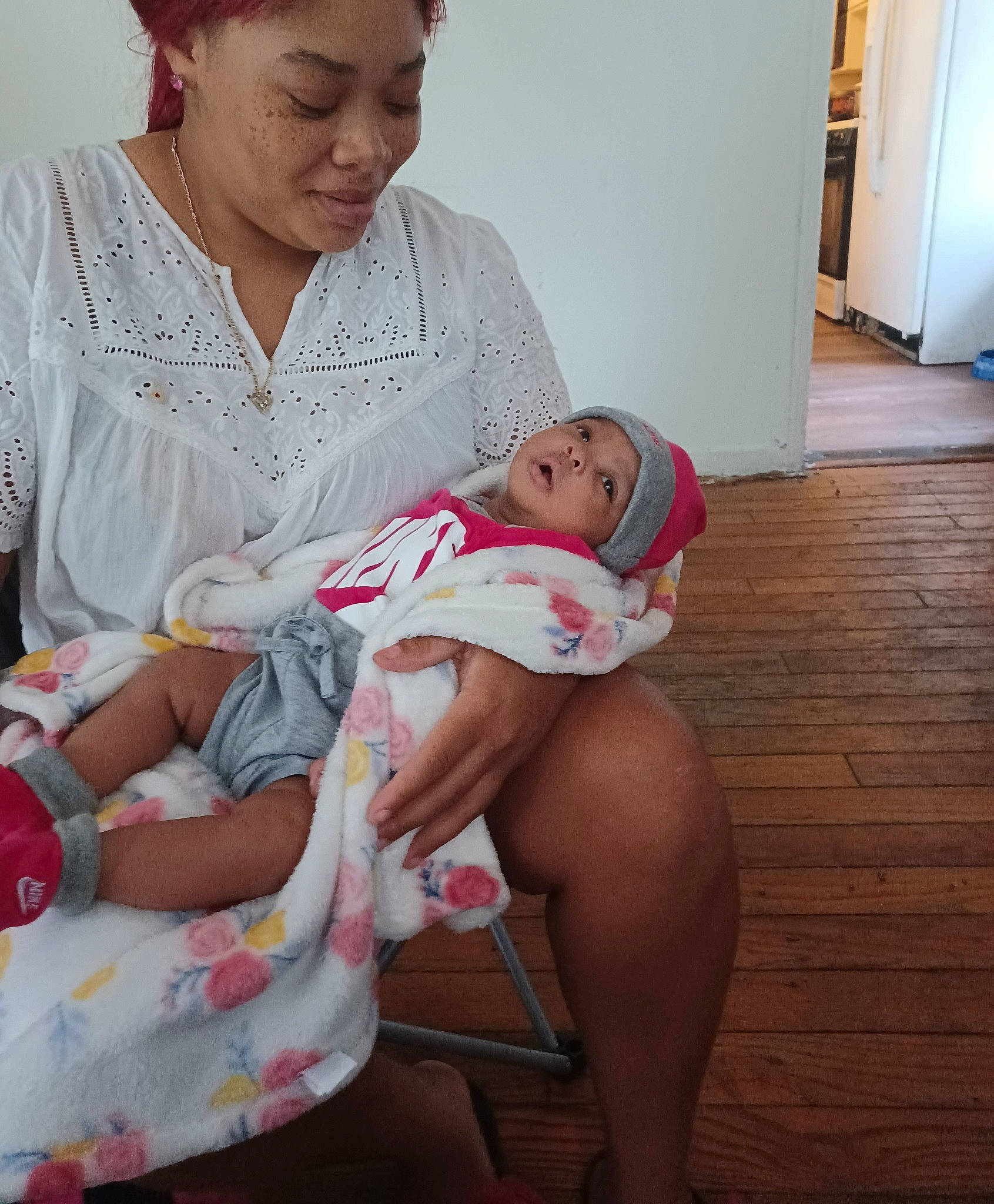 Milli is registered to the contest to win money with this photo: abdomen, baby, chest, child, comfort, door, event, happy, headwear, human_leg, joint, knee, lap, leg, mouth, person, shorts, sitting, skin, thigh