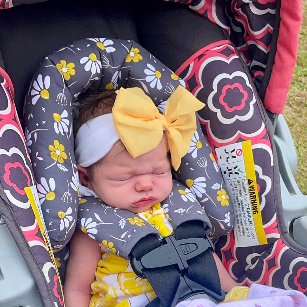 Octavia is registered to the contest to win money with this photo: accessories, baby, car, car_interior, carseat, clothing, cushion, face, hat, head, homedecor, newborn, person, photography, portrait, sleeping, stroller, sunglasses, transportation, vehicle