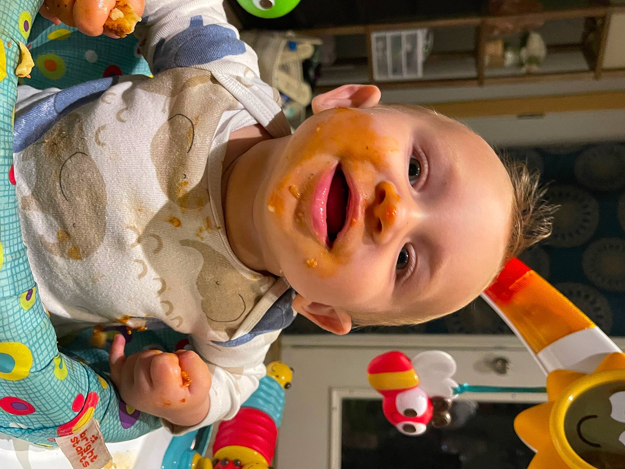 Omari is registered to the contest to win money with this photo: baby, baby_laughing, baby_products, baby_toddler_clothing, baby_toys, child, event, fun, happy, laugh, leisure, linens, mouth, nose, person, play, recreation, room, smile, toddler