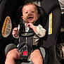 Kamari is registered to the contest to win money with this photo: baby, baby_outfit, car_seat, child, clothing, cute, feeding_tube, happy, head, indoor, infant, legs, newborn, person, safety, seat, smile, sock, straps, warning_label