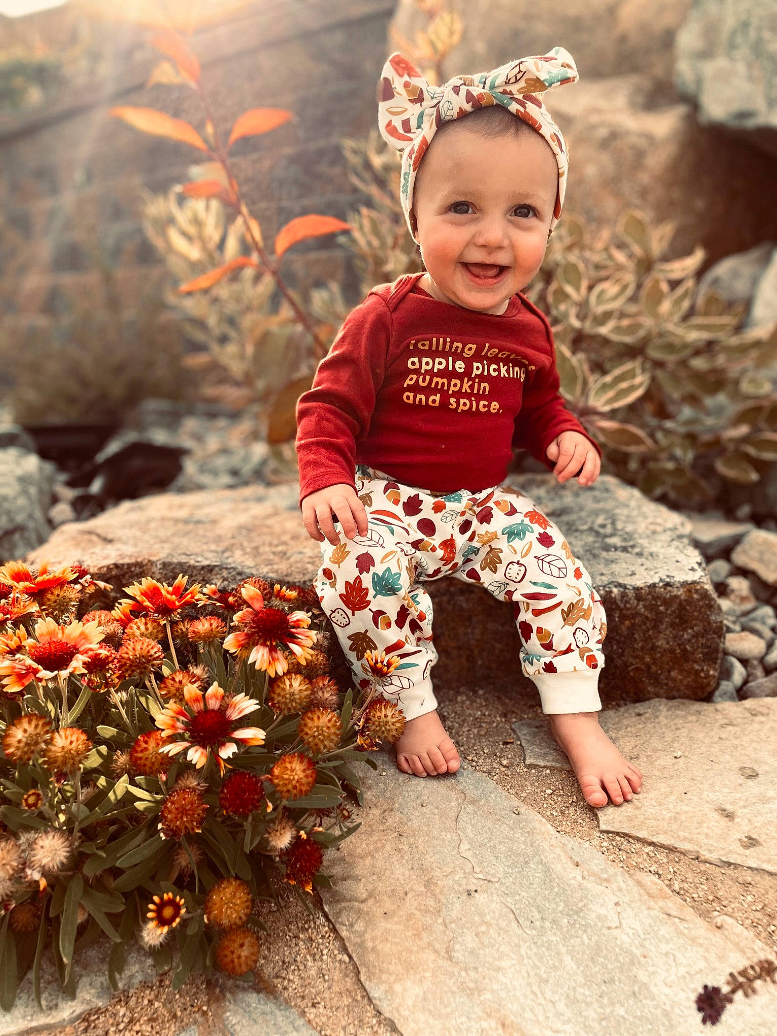 Everly is registered to the contest to win money with this photo: baby, baby_toddler_clothing, child, eye, face, flash_photography, flower, fun, grass, happy, head, jewellery, joy, leaf, orange, people, people_in_nature, person, plant, red