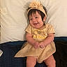 Isabela joined the competition — help win amazing prizes! adorable, baby, bed, cheerful, child, clothing, cute, cute_outfit, dress, happy, headband, indoors, infant, person, portrait, sitting, skin, smiling, young, young_child