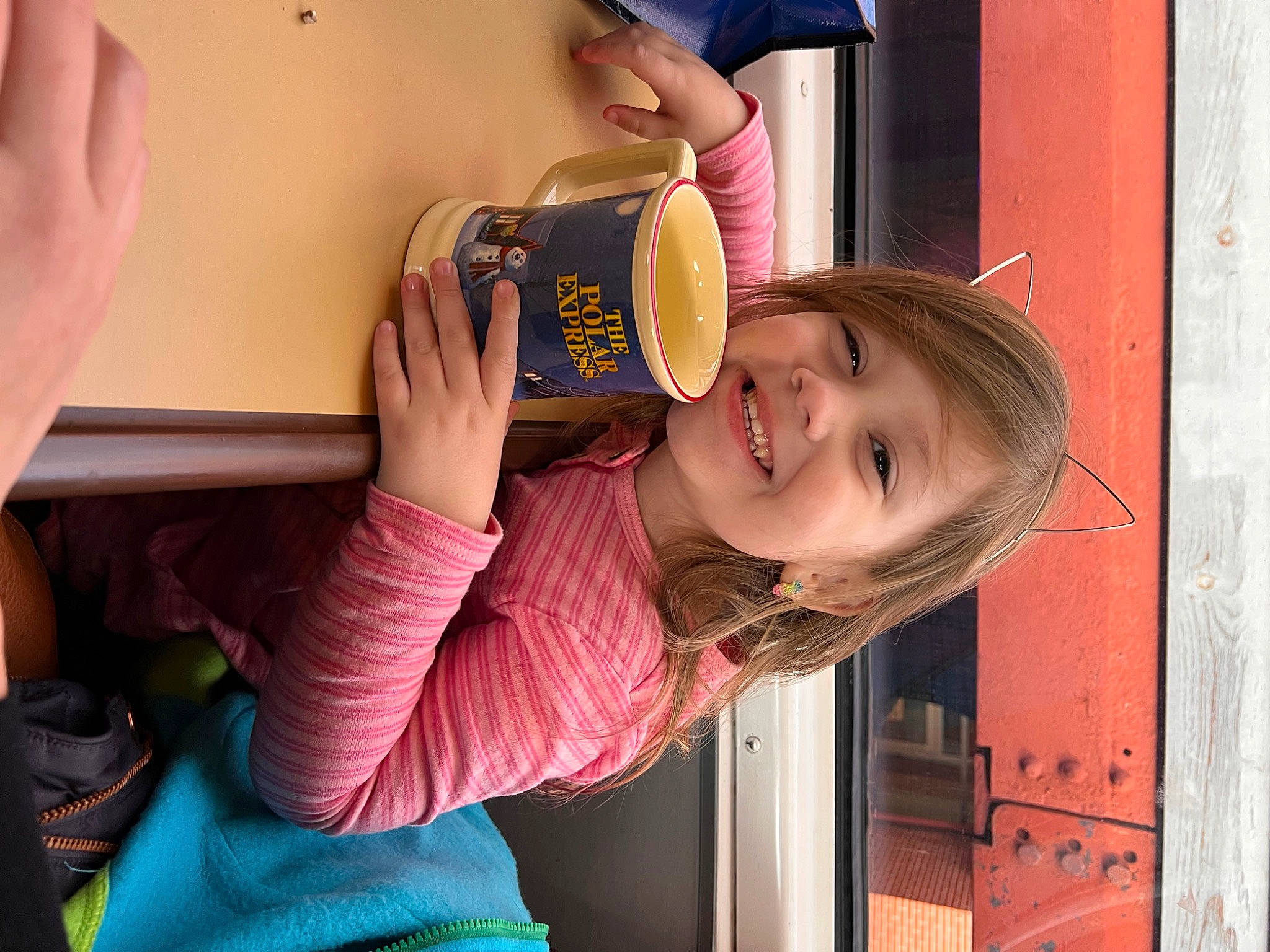 Charlie is registered to the contest to win money with this photo: beauty, blond, child, elbow, face, finger, food, fun, gesture, hair, hand, happy, head, joy, leisure, person, pink, skin, smile, thumb