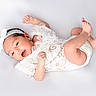 baby, infant, white_lace, headband, newborn, cute, lying_down, happy, soft_background, skin, small_feet, tiny_hands, portrait, child, smiling, innocent, studio_photo, white_clothing, fresh, peaceful