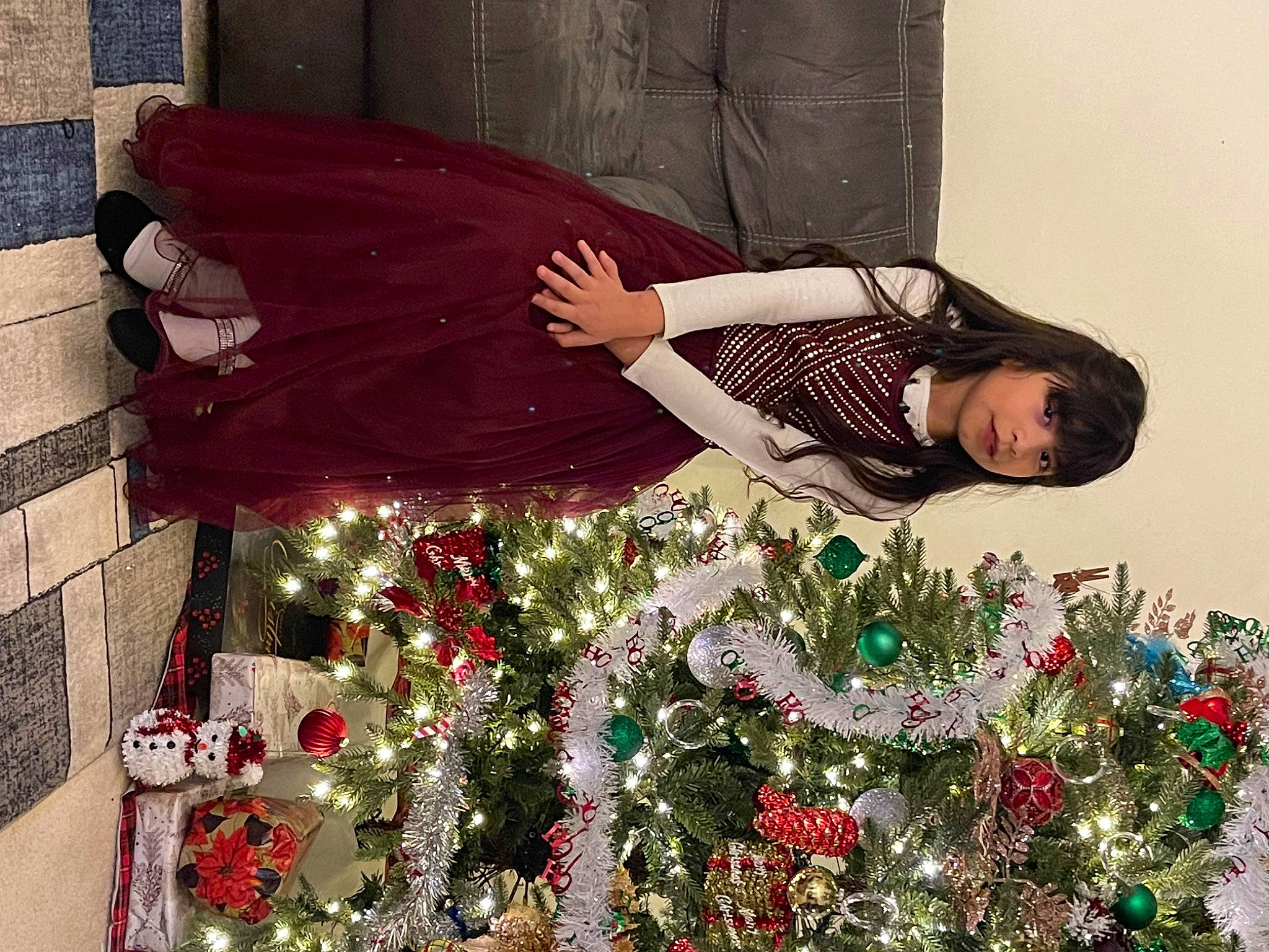 Alexa is registered to the contest to win money with this photo: christmas, christmas_decoration, christmas_eve, christmas_ornament, christmas_tree, dress, event, floral_design, green, happy, holiday, holiday_ornament, human_body, interior_design, ornament, person, plant, red, sleeve, textile