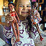 Dorothy joined the competition — help win amazing prizes! child, smiling, doll, toy, indoor, pajamas, person, happy, face, hair, hand, furniture, living_room, pattern, holding, playful, cute, portrait, girl, home