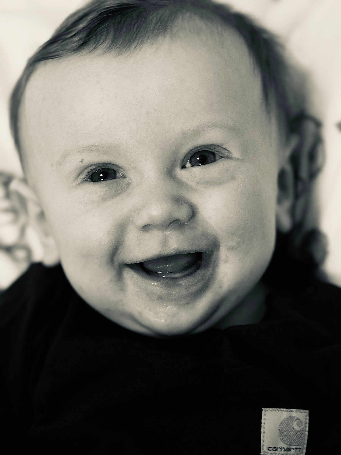 Weston is registered to the contest to win money with this photo: baby, smile, face, closeup, infant, child, black_and_white, happy, eyes, mouth, cute, person, portrait, young, expression, skin, head, clothing, babyclothes, cheerful