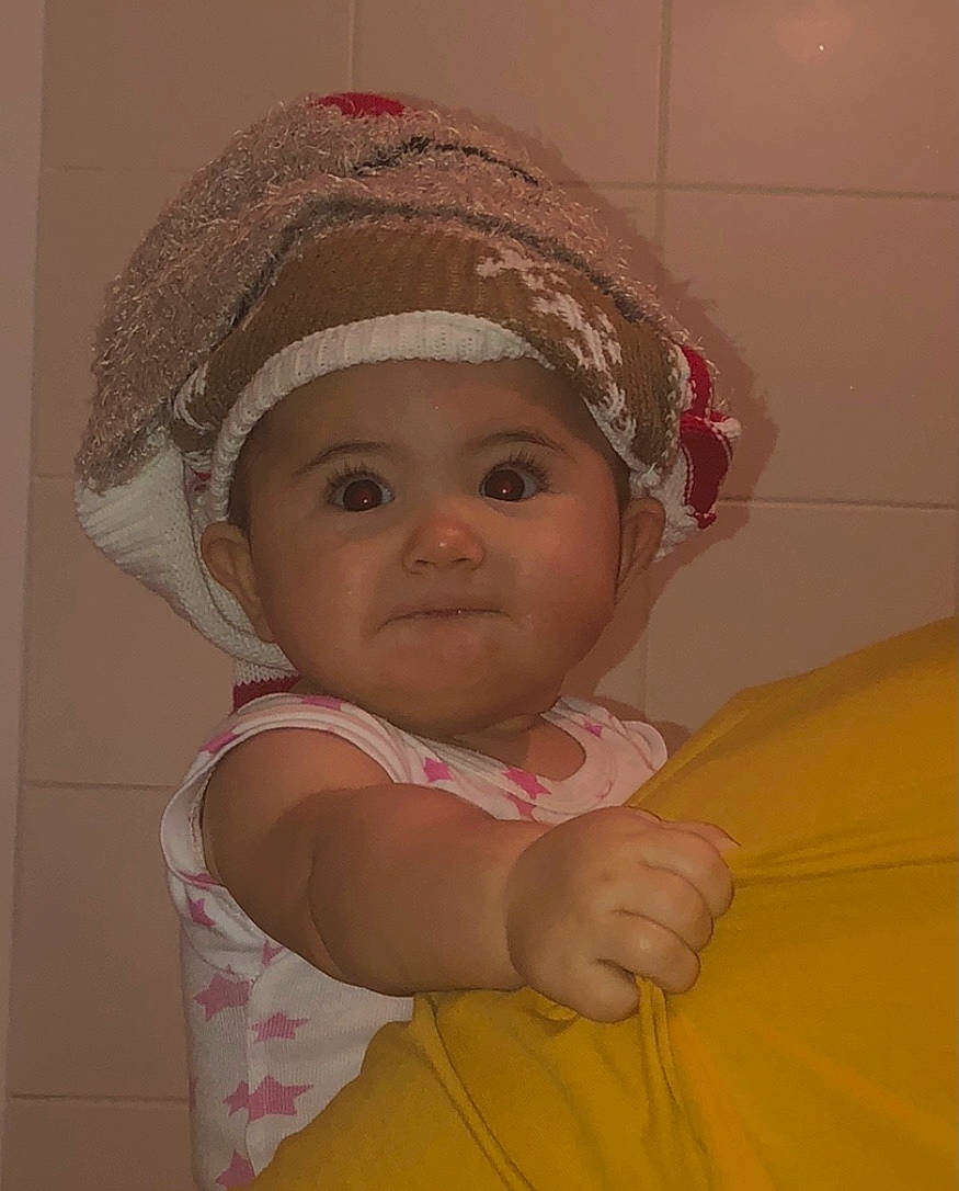 Hayden participe au concours pour gagner de l'argent avec cette photo : baby, baby_toddler_clothing, cap, cheek, child, chin, dress, eye, eyebrow, face, fashion_accessory, fun, happy, headgear, headwear, iris, lip, nose, person, pink